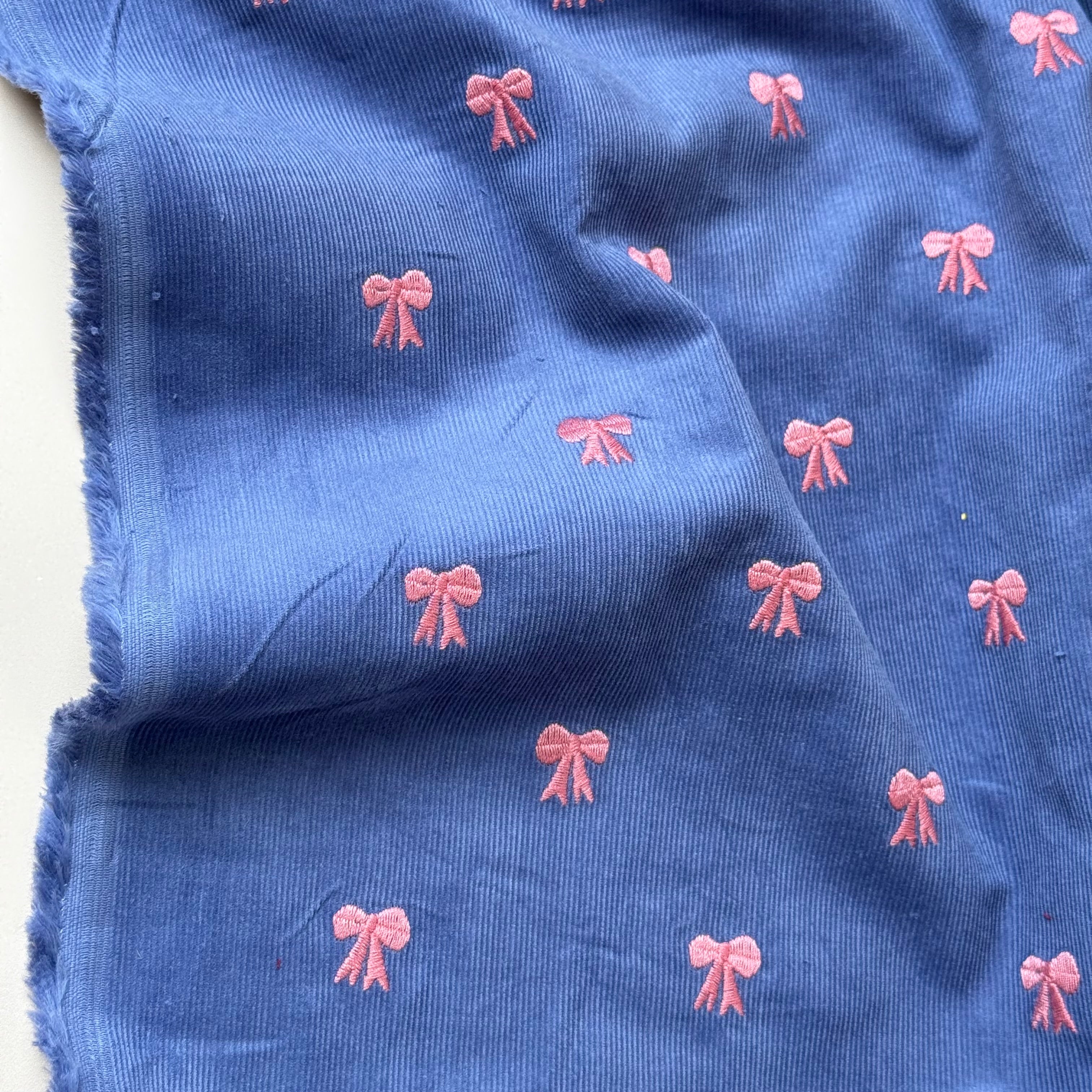 Embroidered Bows on Cornflower Blue Cotton Needlecord
