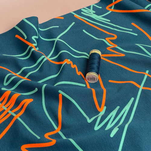 Neon Doodles on Dark Teal Cotton Jersey Fabric