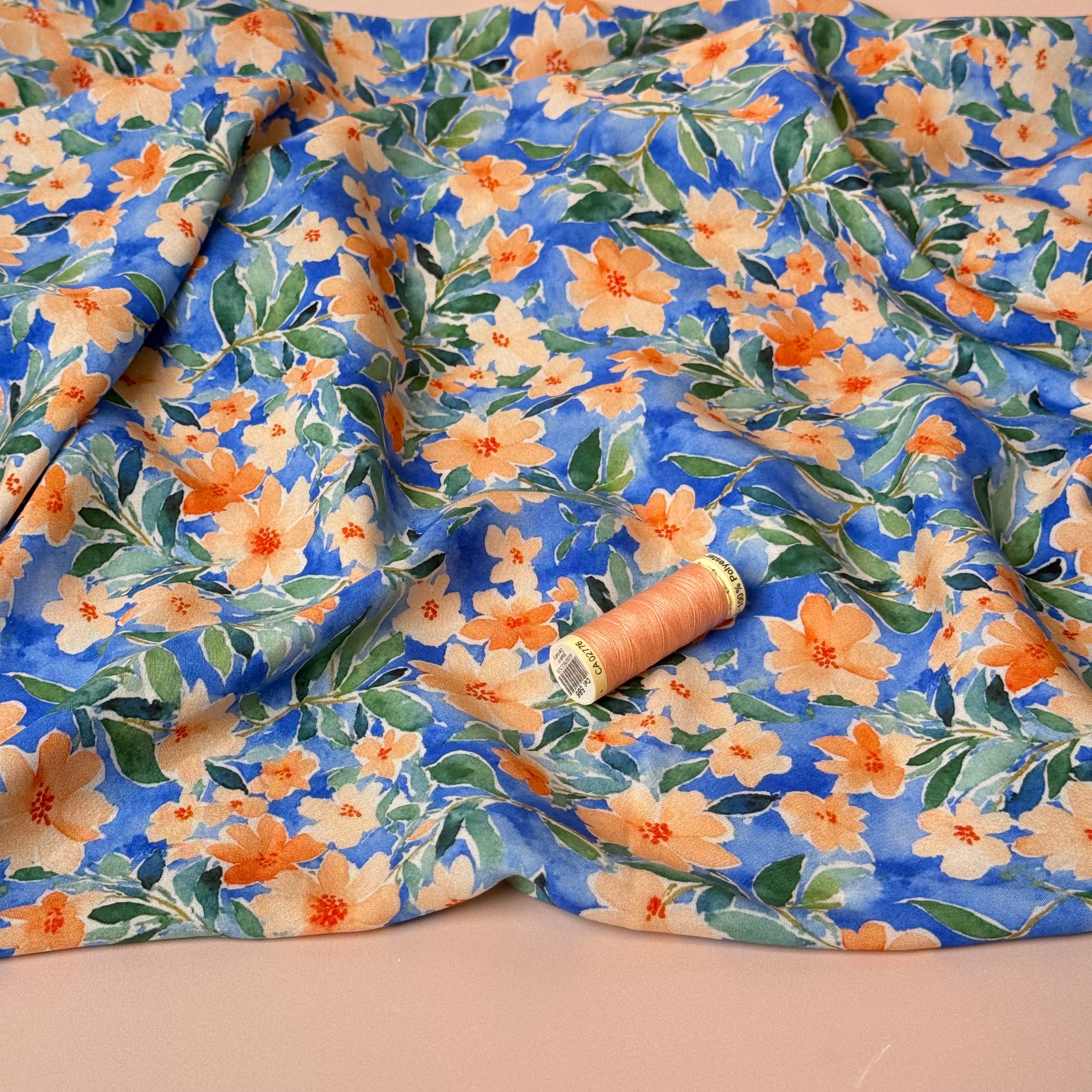 Peach Watercolour Flowers on Blue Viscose Fabric