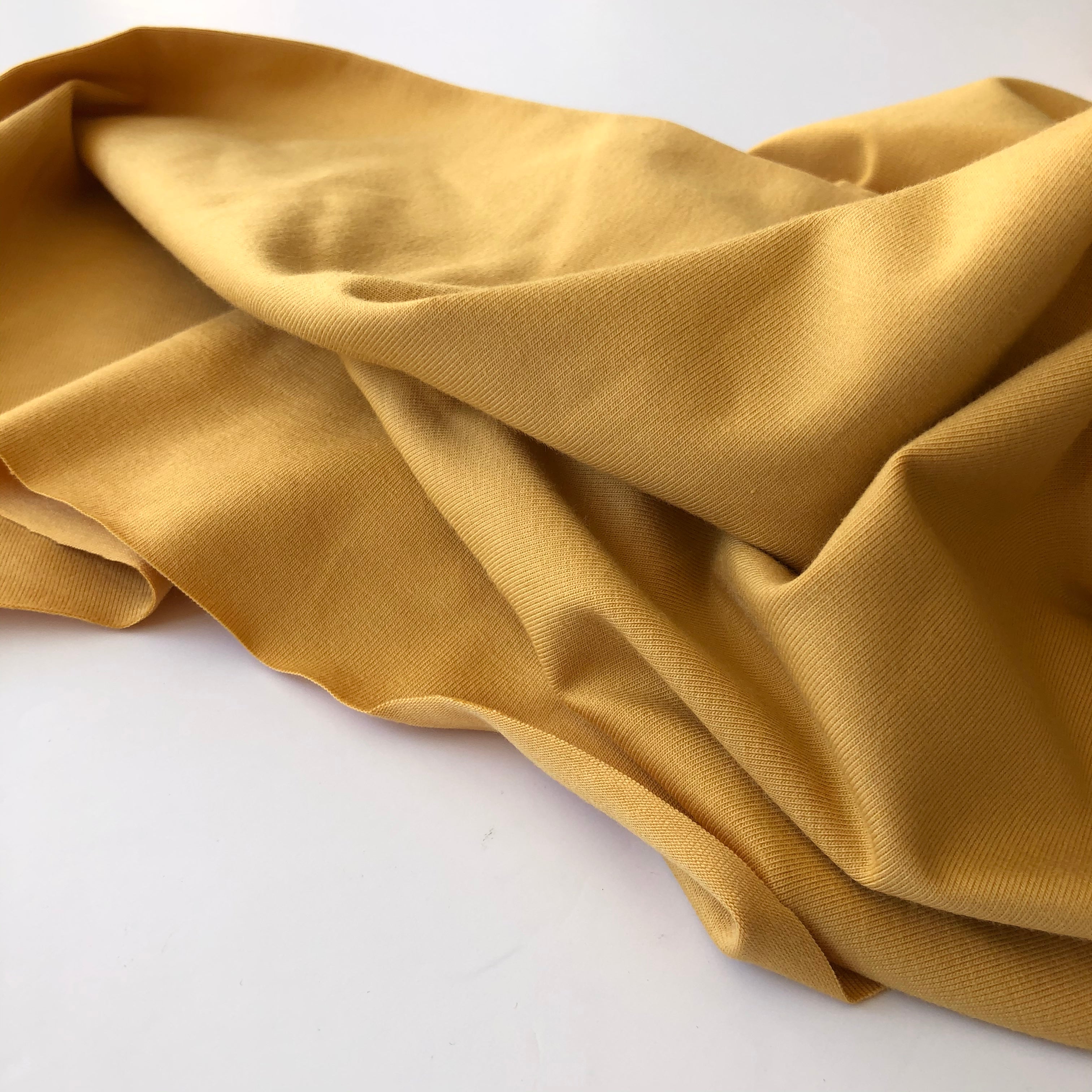 REMNANT 1.00 Metre with washable dirt marks - Essential Chic Amber Plain Cotton Jersey Fabric