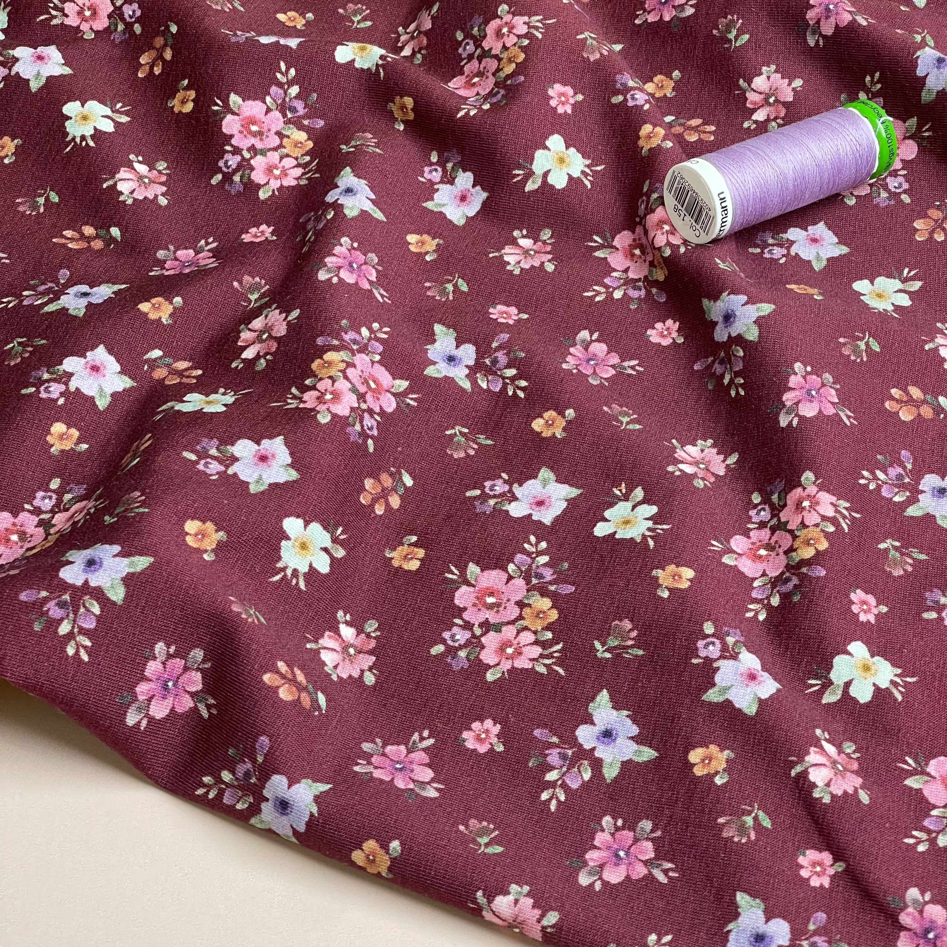 Scattered Autumn Flowers on Burgundy Cotton Jersey Fabric