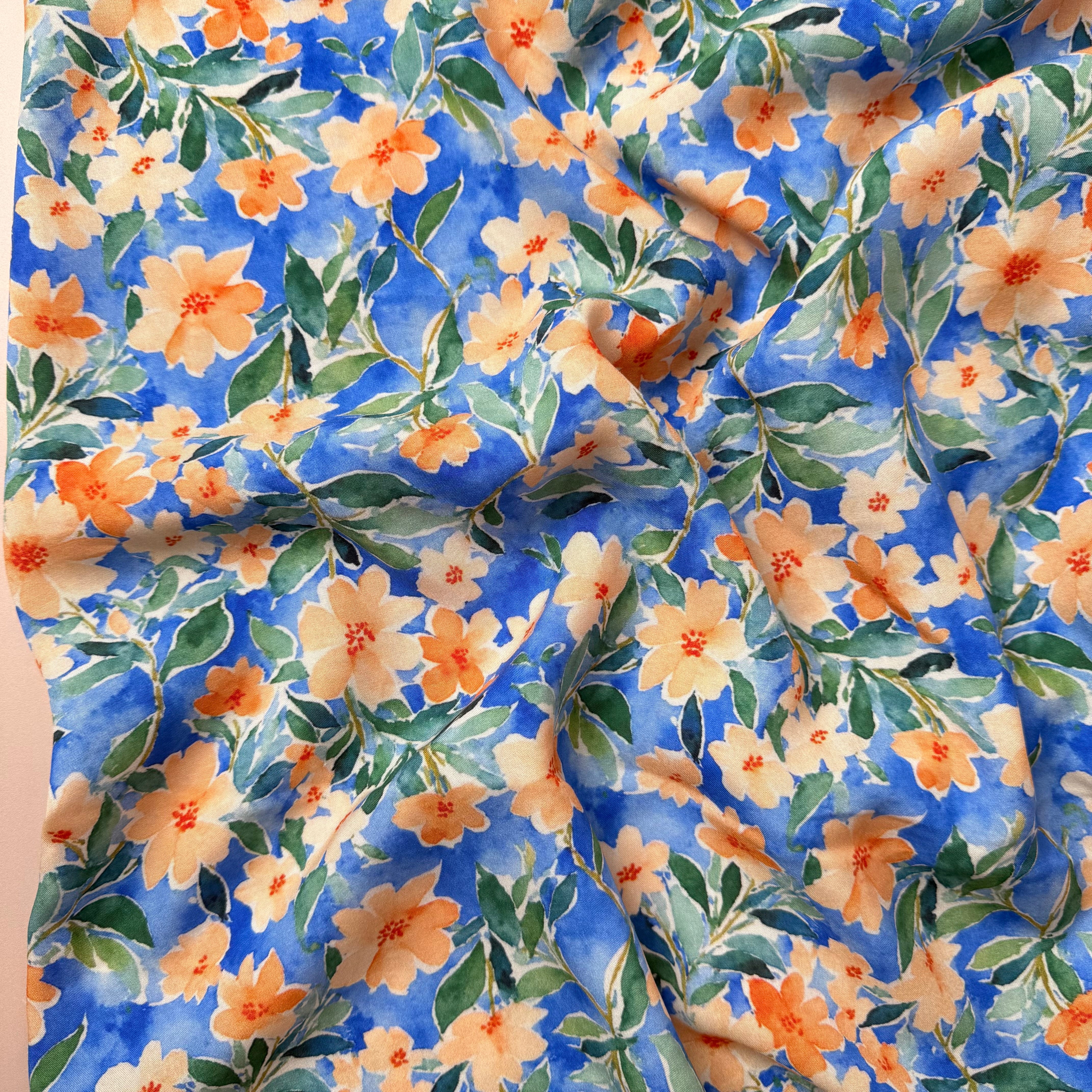Peach Watercolour Flowers on Blue Viscose Fabric