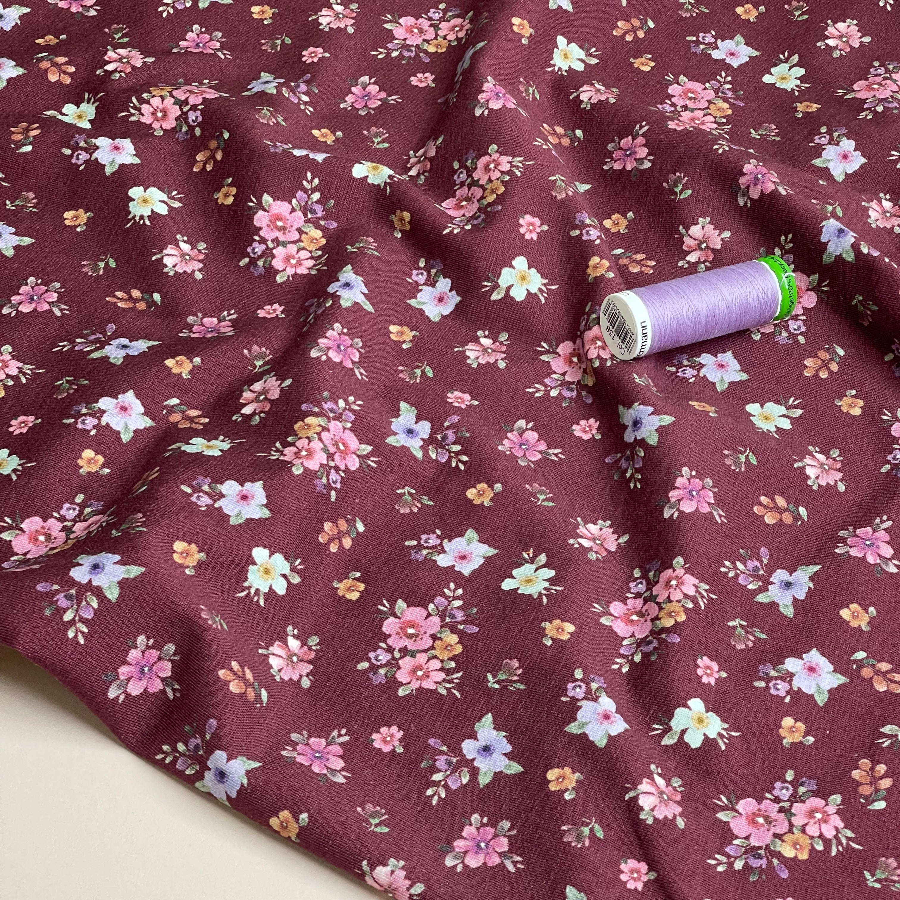 Scattered Autumn Flowers on Burgundy Cotton Jersey Fabric