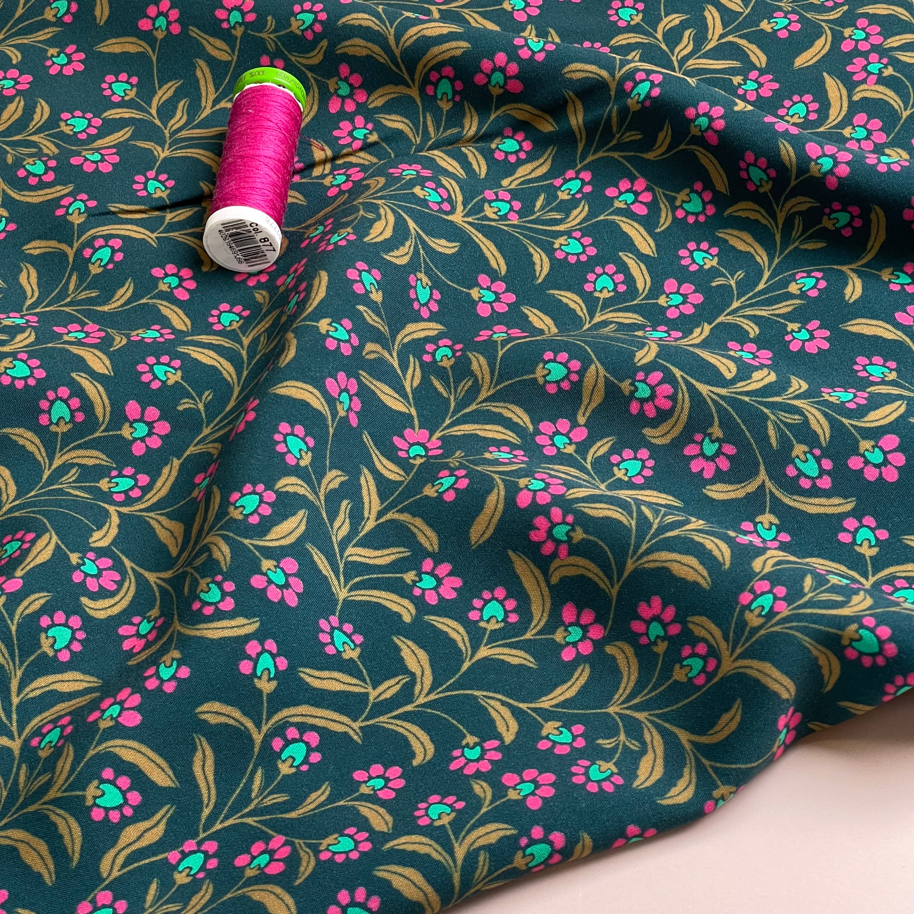 Ditsy Flowers on Green Viscose Fabric
