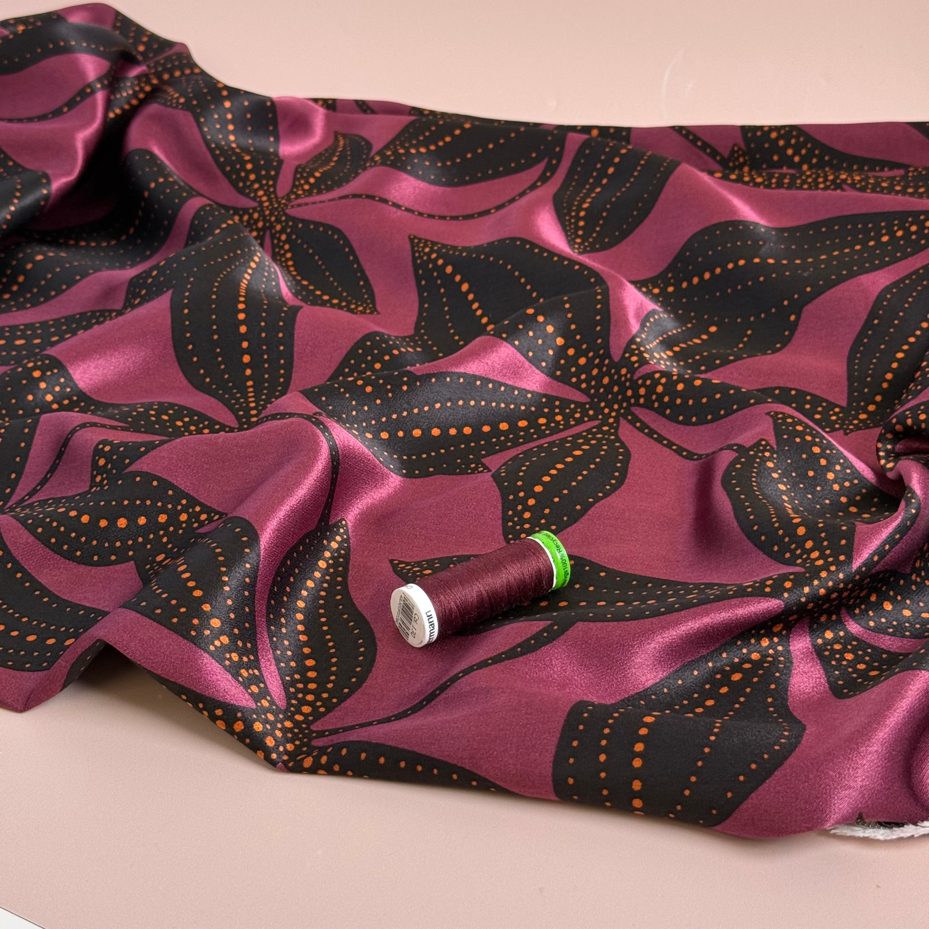Spoty Flowers on Wine Spun Viscose Sateen Fabric