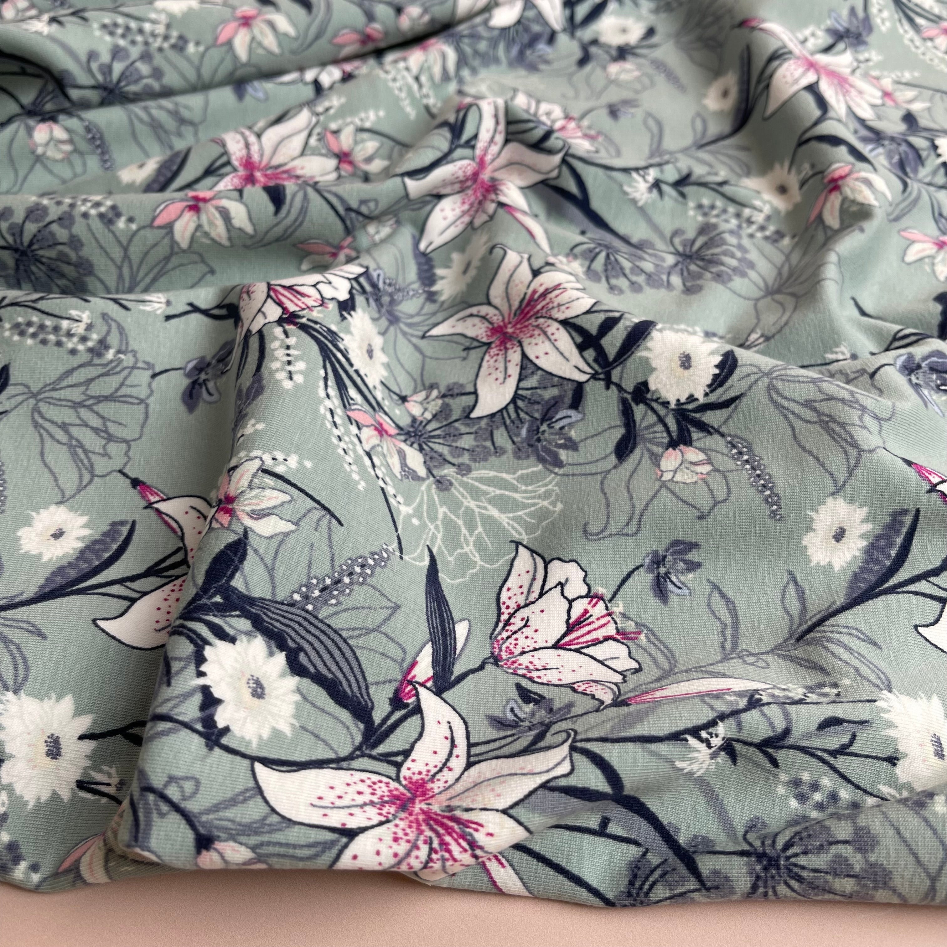 Lilies on Sage Green Cotton Jersey Fabric