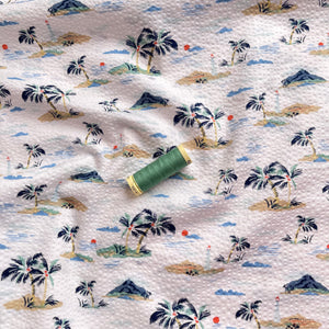 Holiday Islands on White Cotton Seersucker Fabric