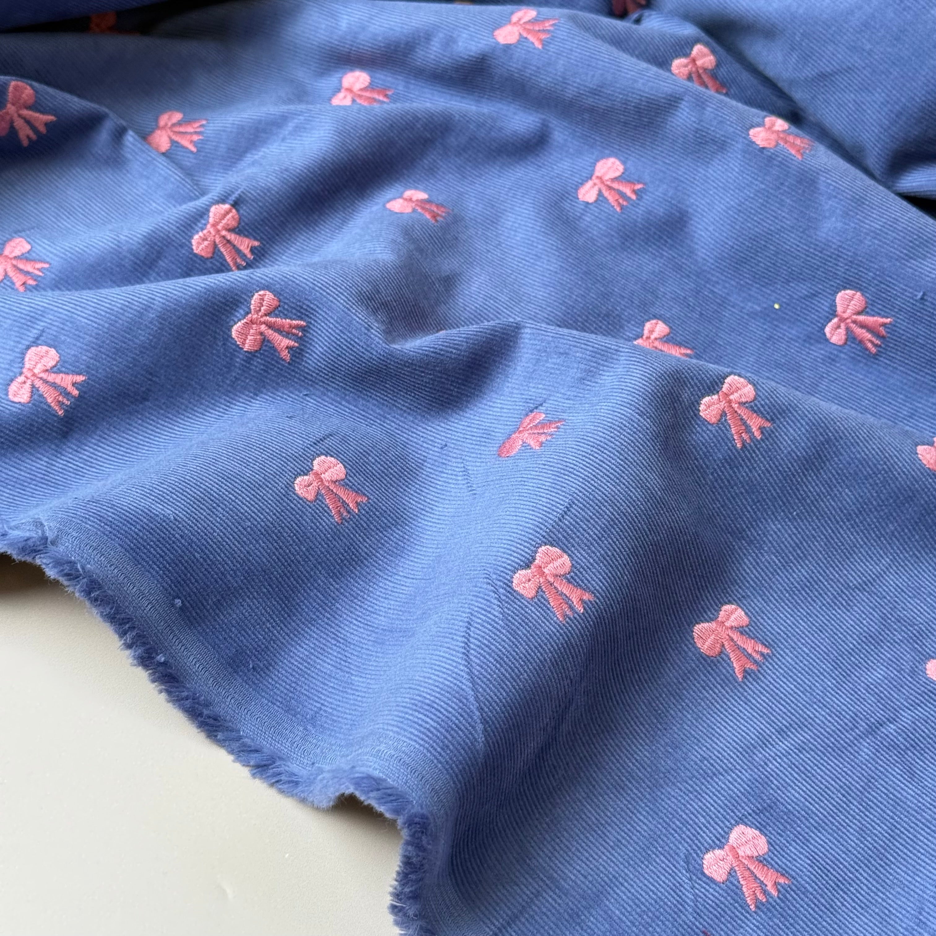 Embroidered Bows on Cornflower Blue Cotton Needlecord