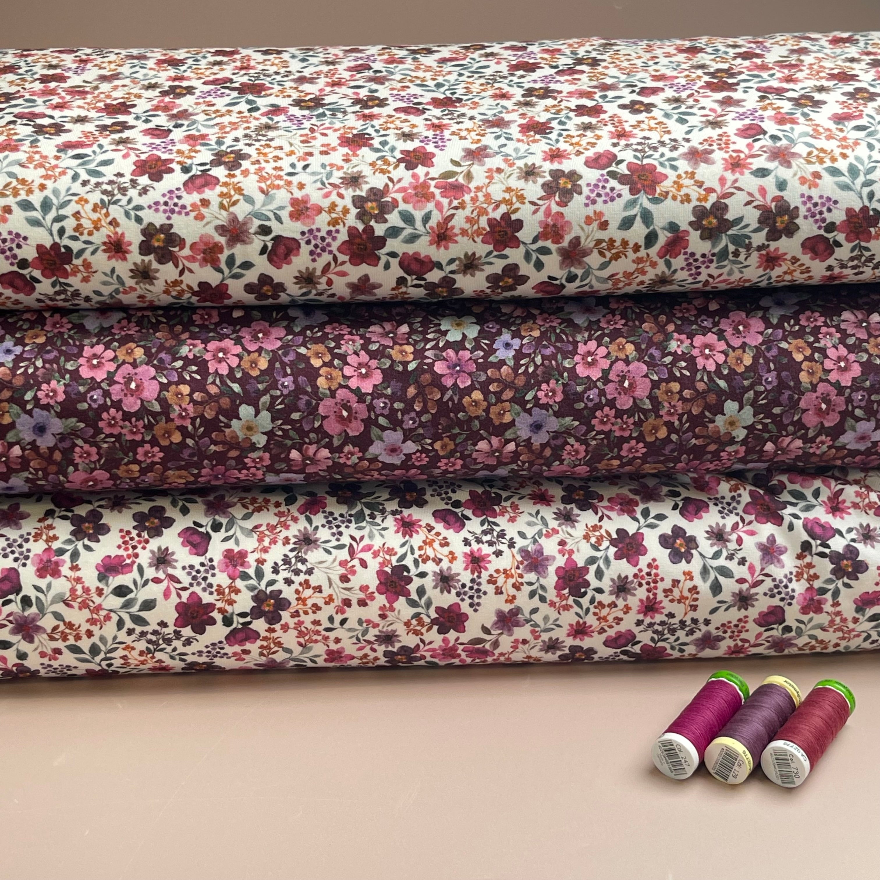 Ditsy Plum Flowers on White Cotton Jersey Fabric