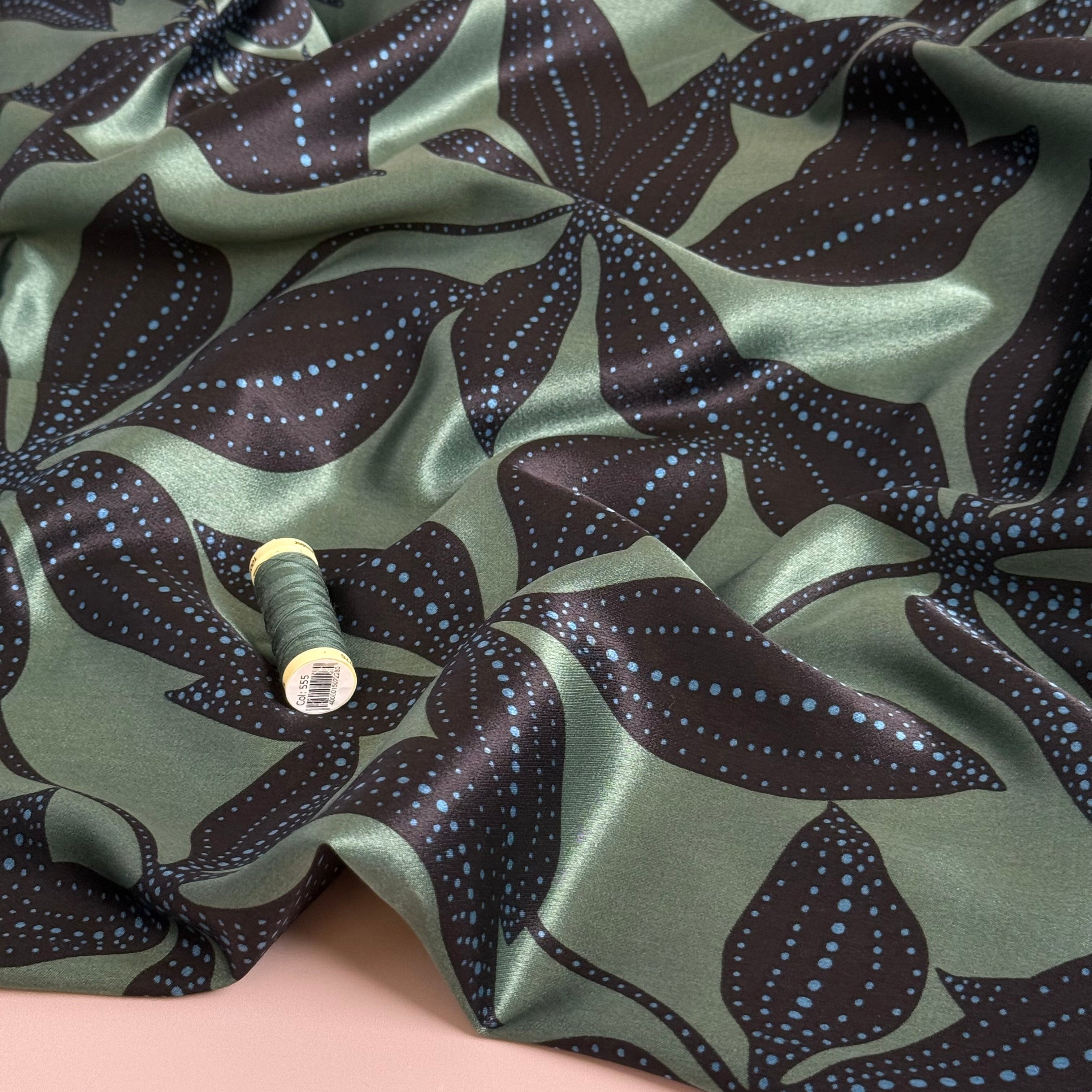 Spotty Flowers on Green Spun Viscose Sateen Fabric