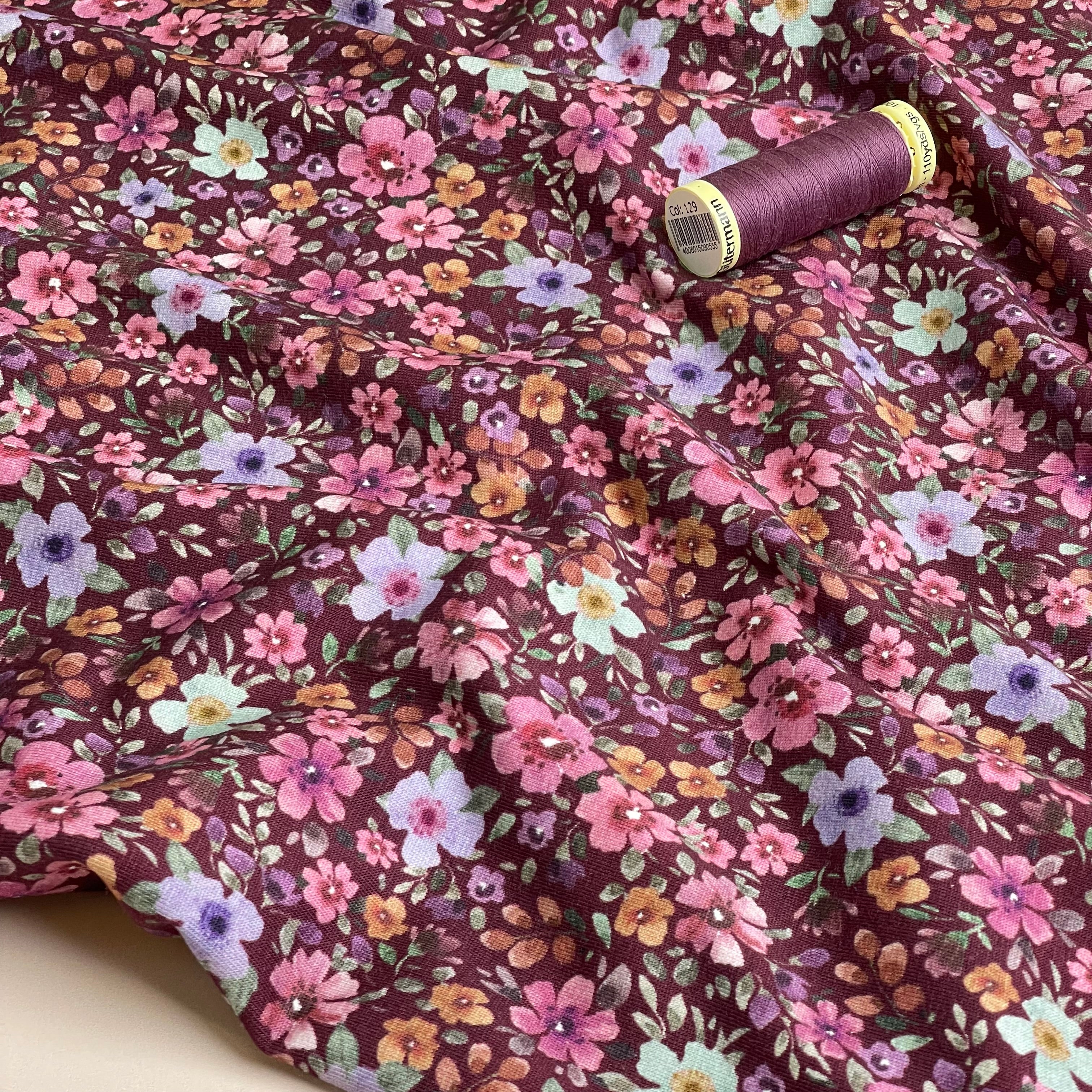 Ditsy Autumn Flowers on Burgundy Cotton Jersey Fabric