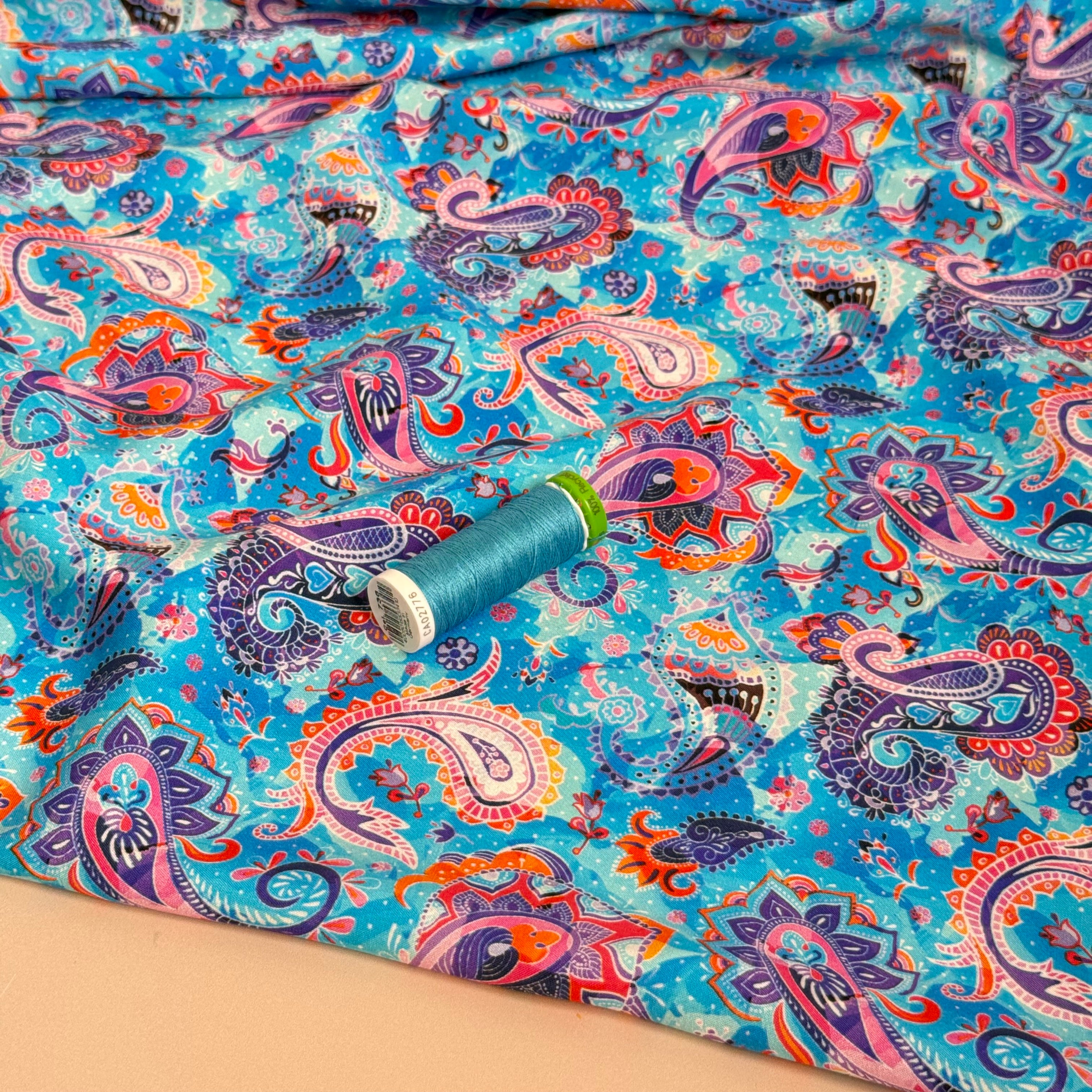 Purple Paisley on Turquoise Viscose Poplin Fabric