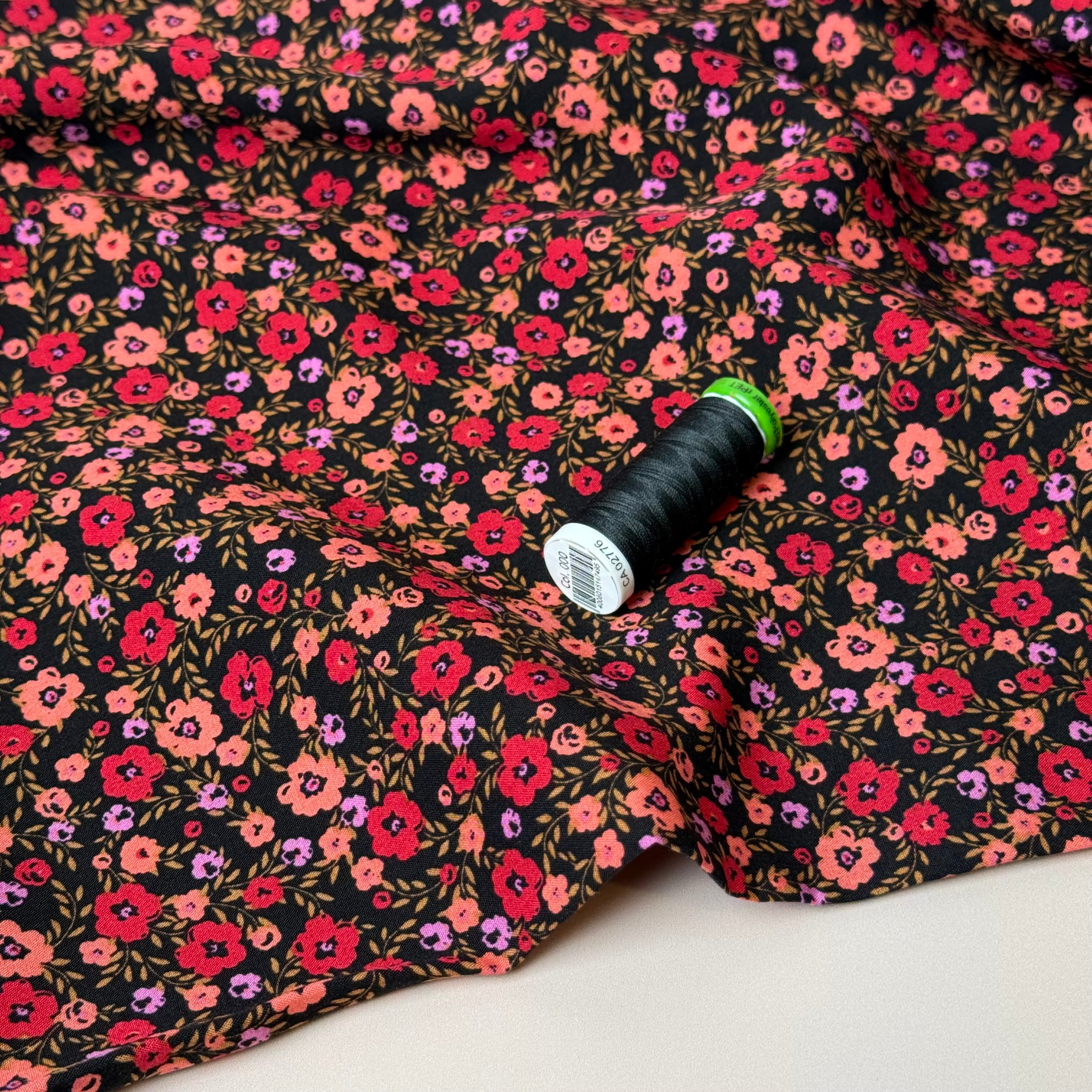 Ditsy Flowers on Black Viscose Fabric