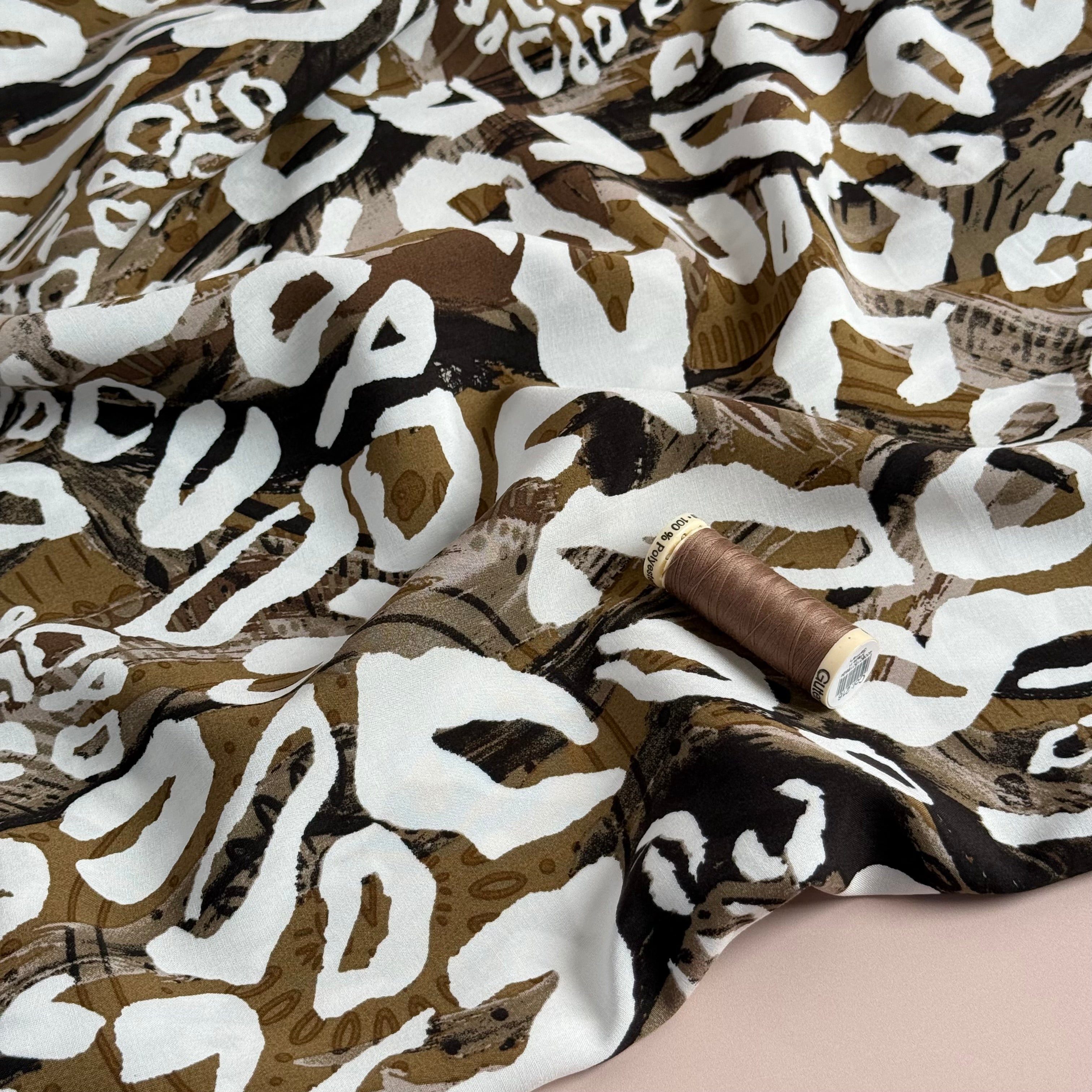 White Leopard on Brown Viscose Poplin Fabric