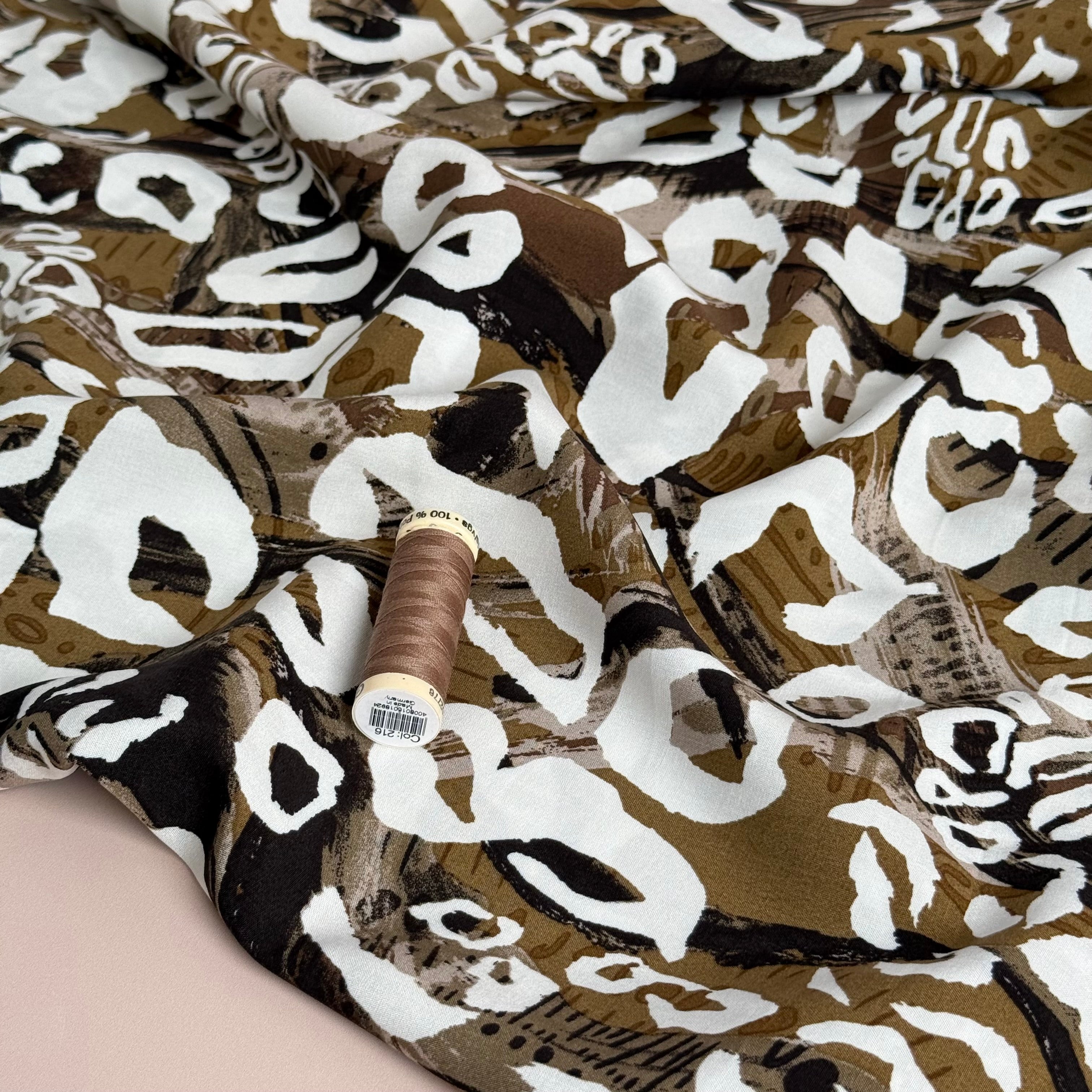 White Leopard on Brown Viscose Poplin Fabric