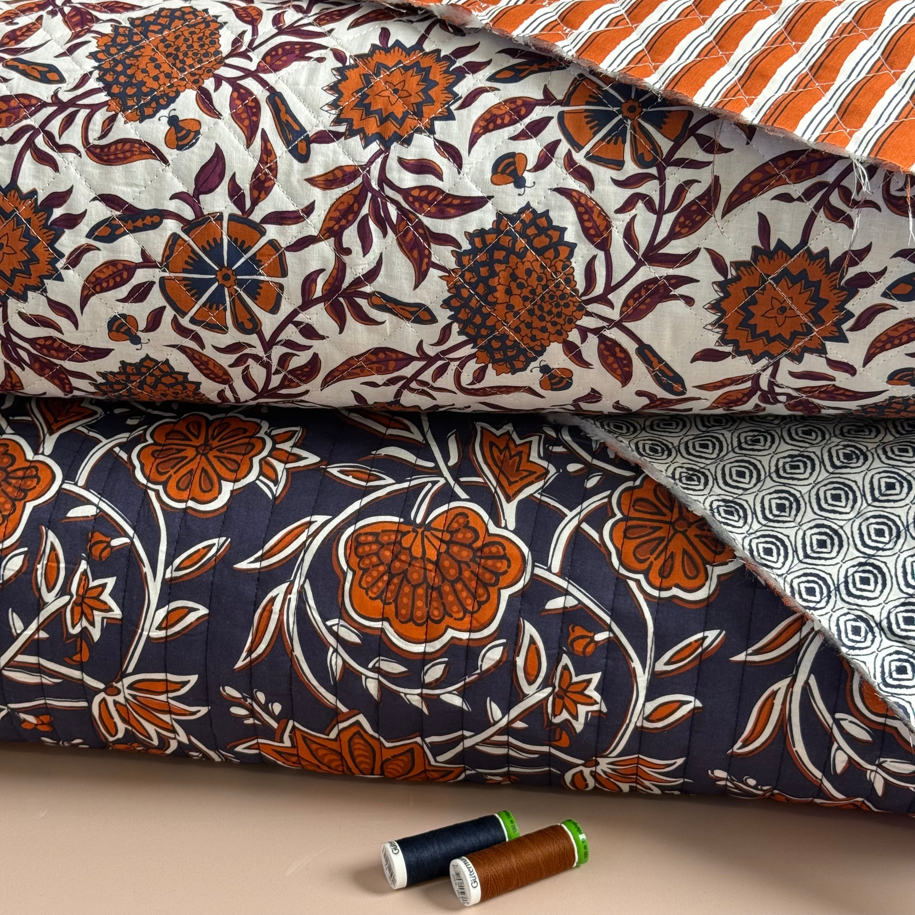 Ornamental Rust Flowers on Off-White Quilted Cotton Fabric