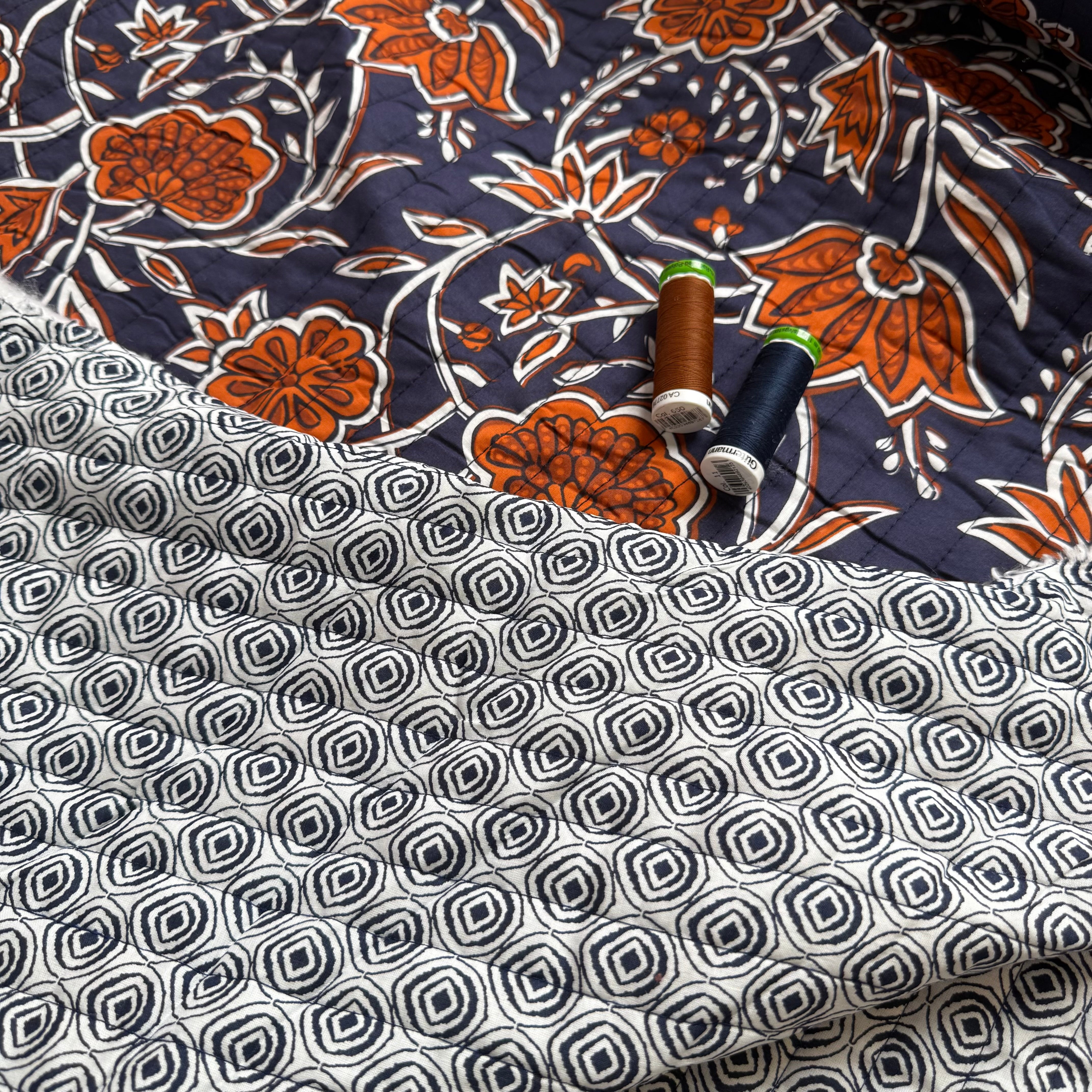 Ornamental Rust Flowers on Navy Quilted Cotton Fabric