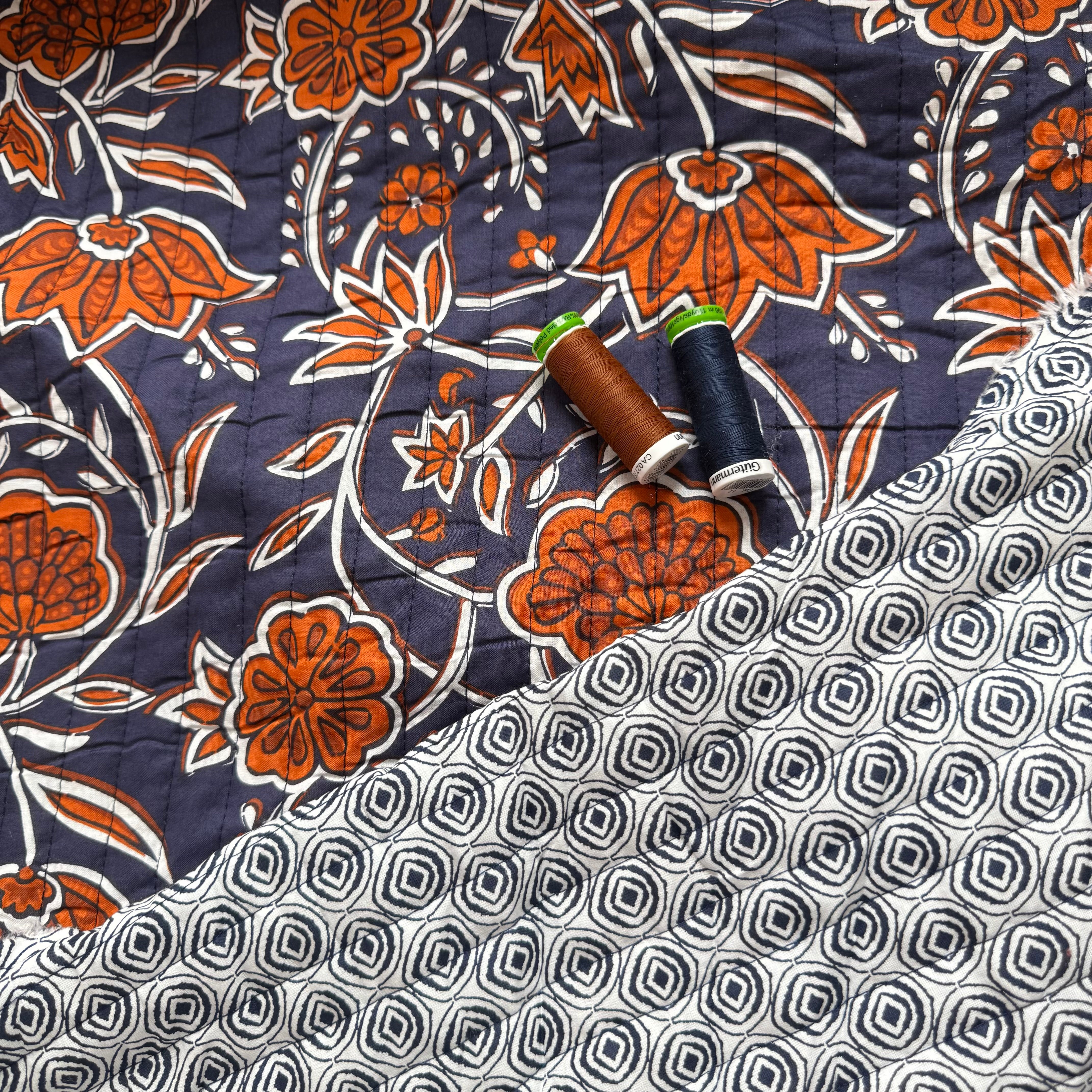 Ornamental Rust Flowers on Navy Quilted Cotton Fabric