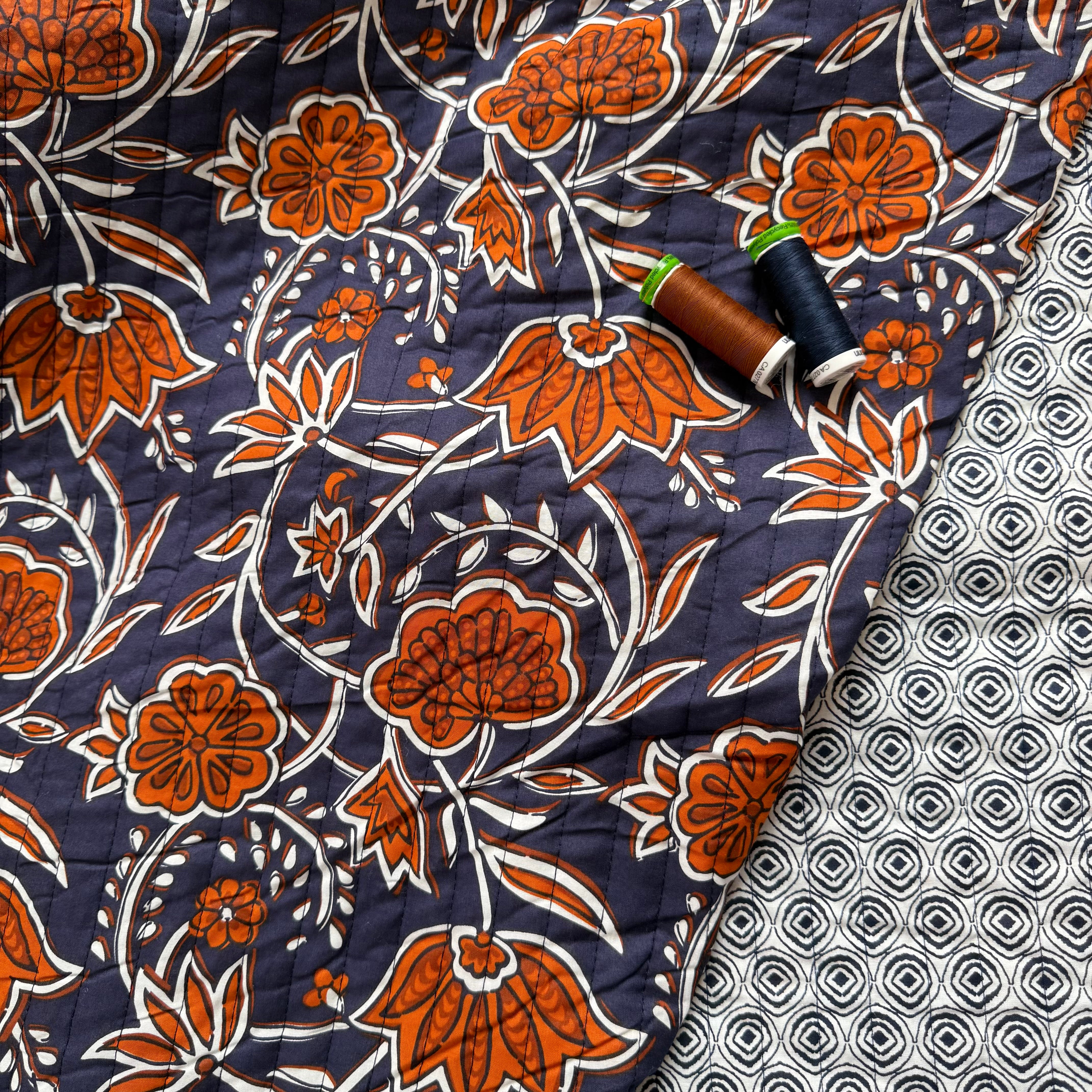 Ornamental Rust Flowers on Navy Quilted Cotton Fabric