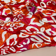 White Leopard on Coral Viscose Poplin Fabric