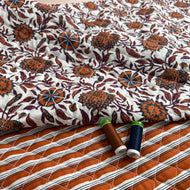 Ornamental Rust Flowers on Off-White Quilted Cotton Fabric