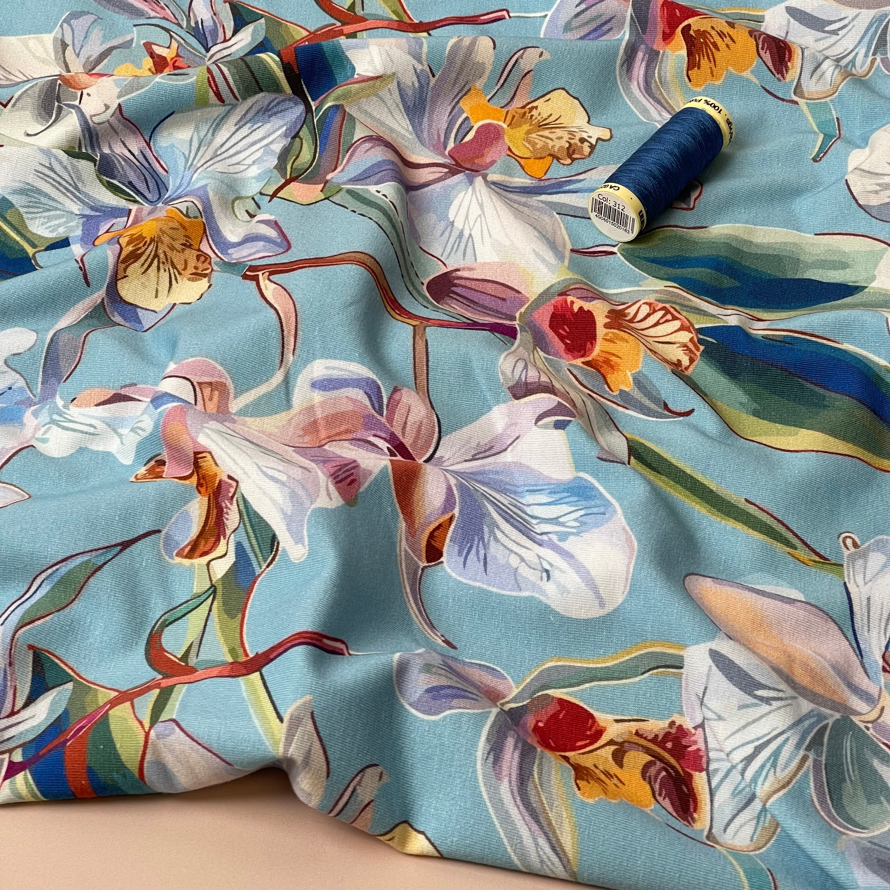 Lilies on Blue Cotton Jersey Fabric
