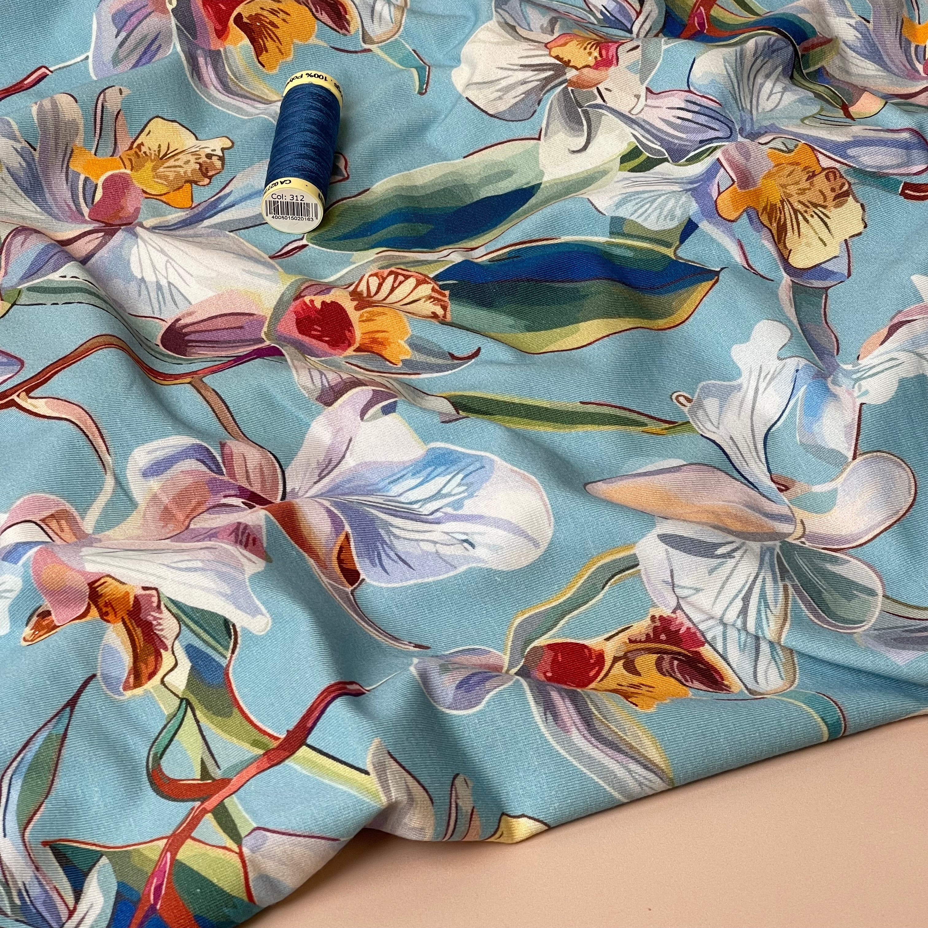 Lilies on Blue Cotton Jersey Fabric