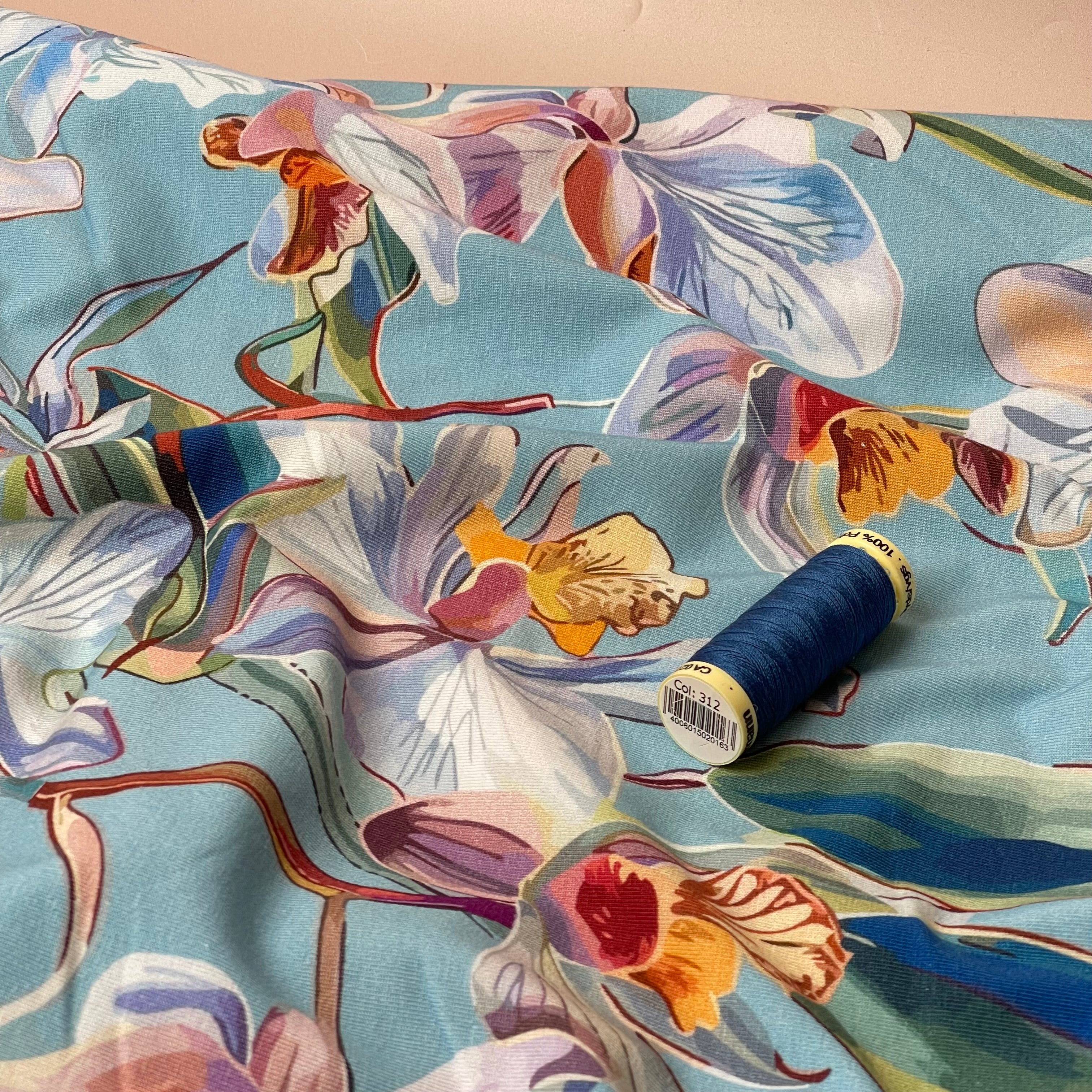 Lilies on Blue Cotton Jersey Fabric