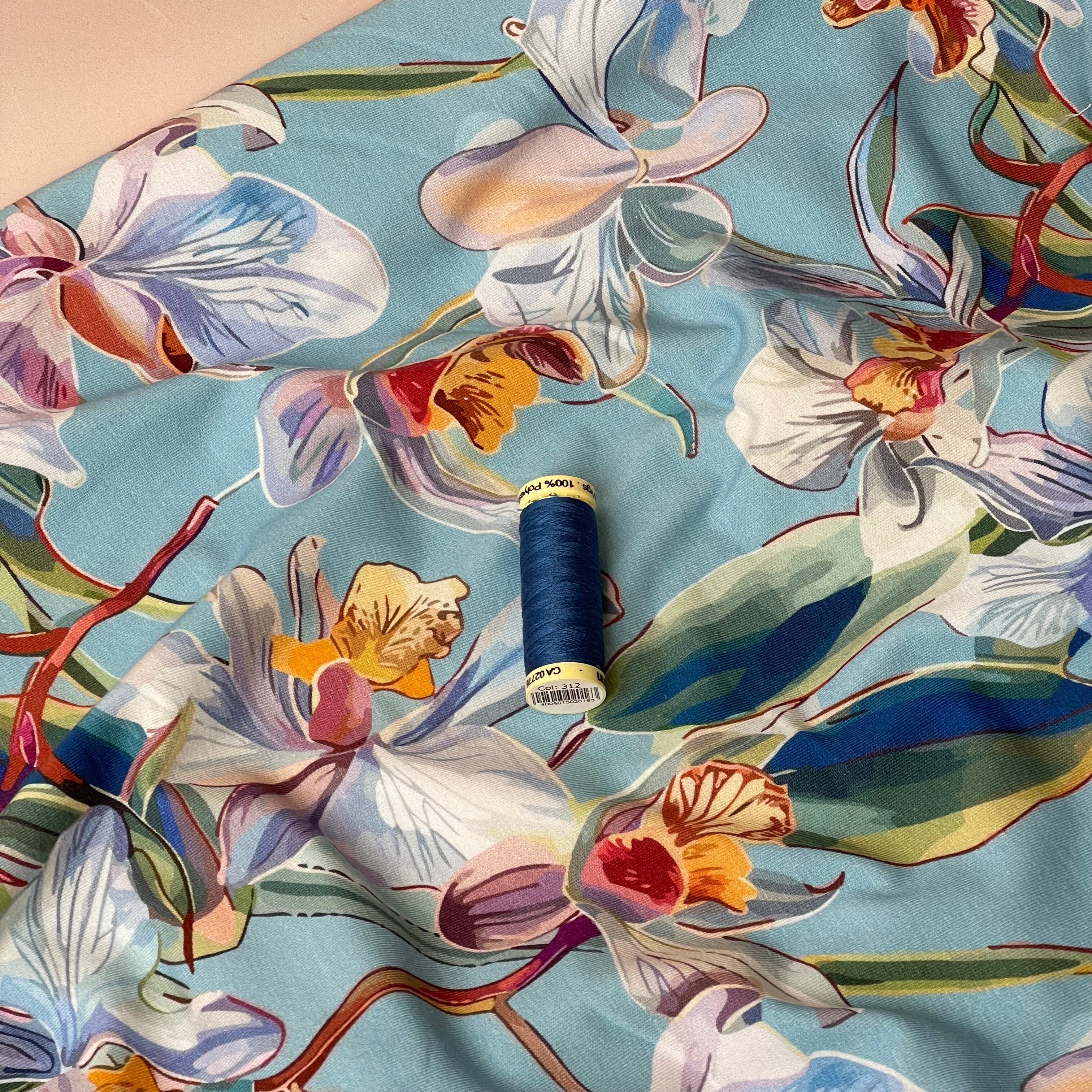 Lilies on Blue Cotton Jersey Fabric