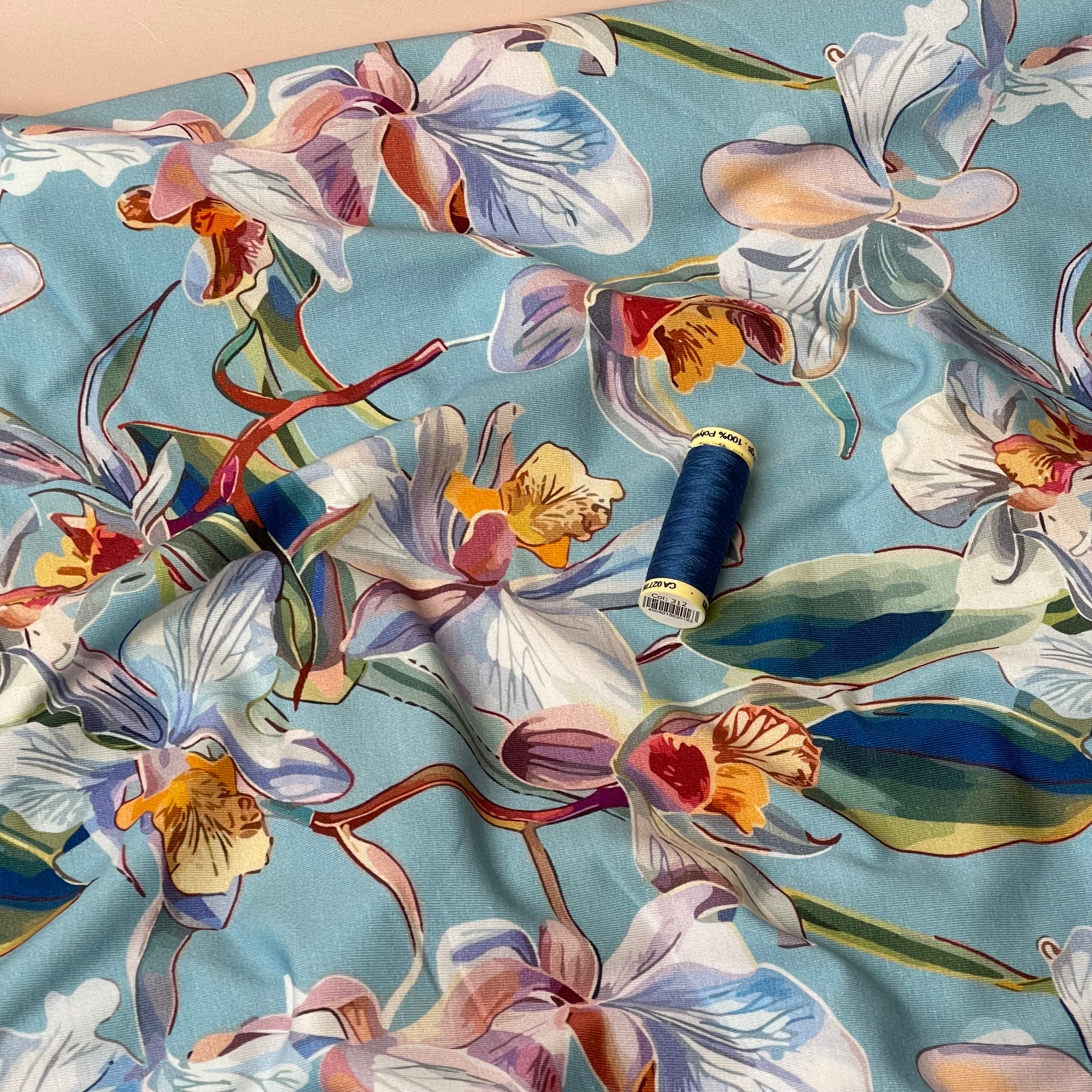 Lilies on Blue Cotton Jersey Fabric