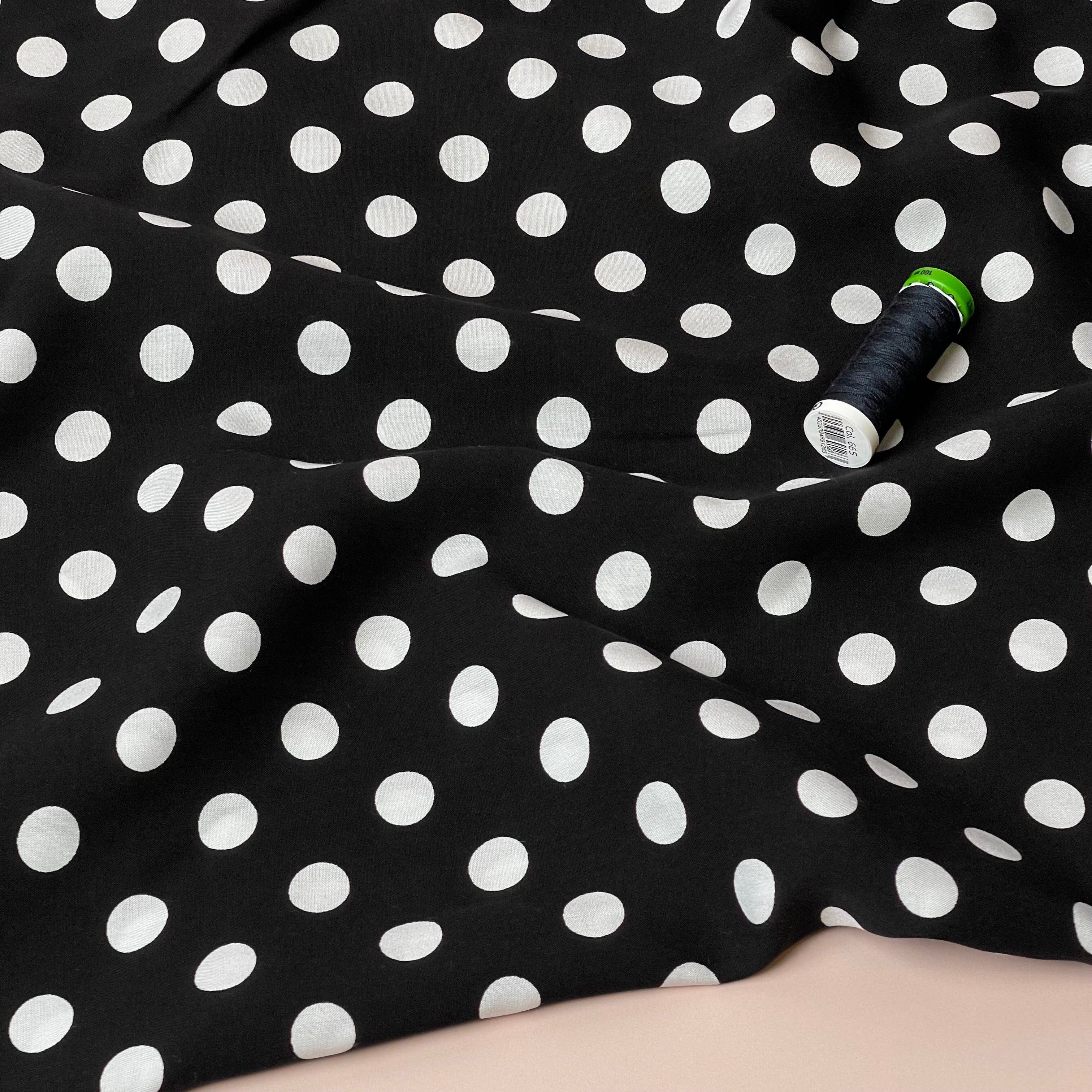 Polka Dots on Black Viscose Poplin Fabric