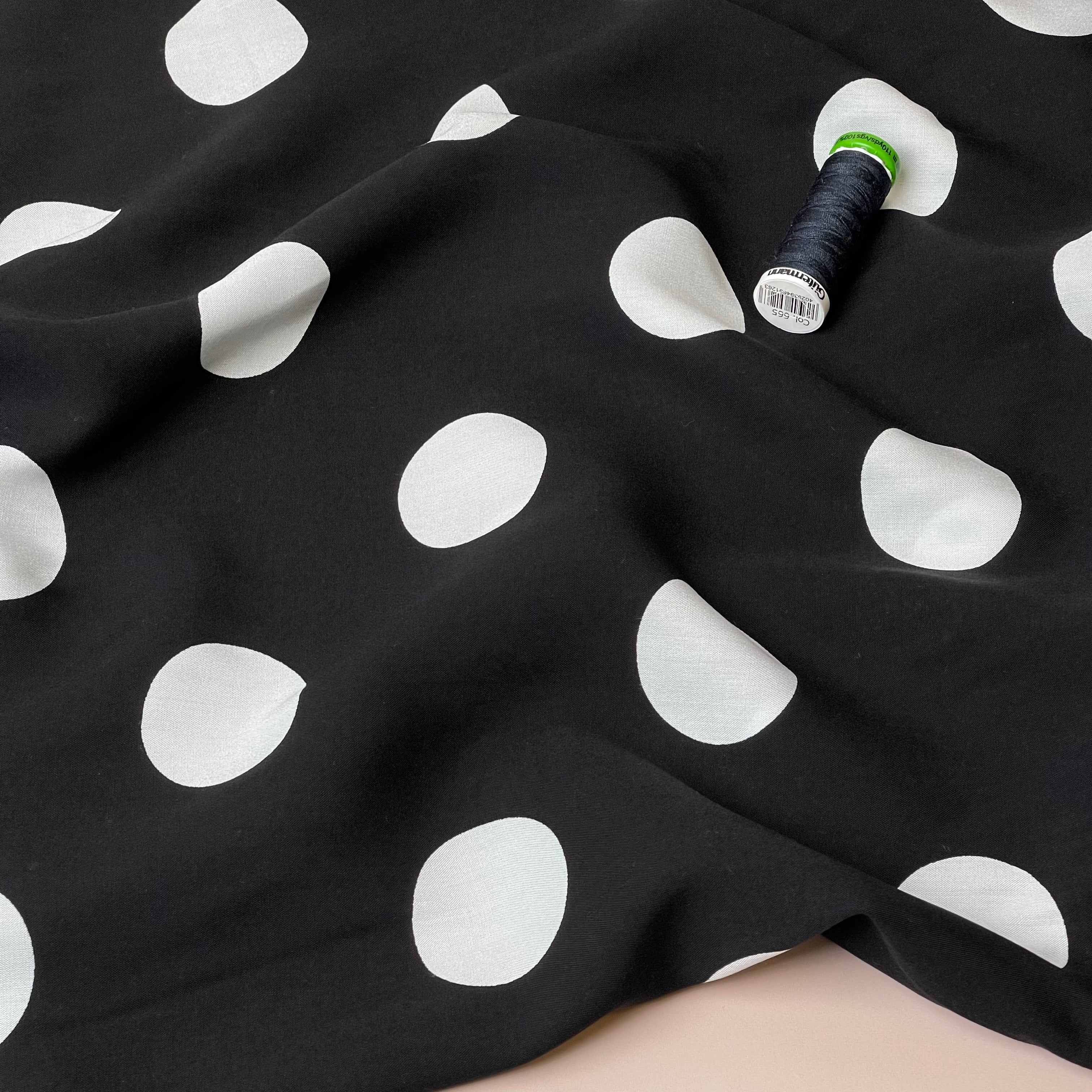 Large Polka Dots on Black Viscose Poplin Fabric