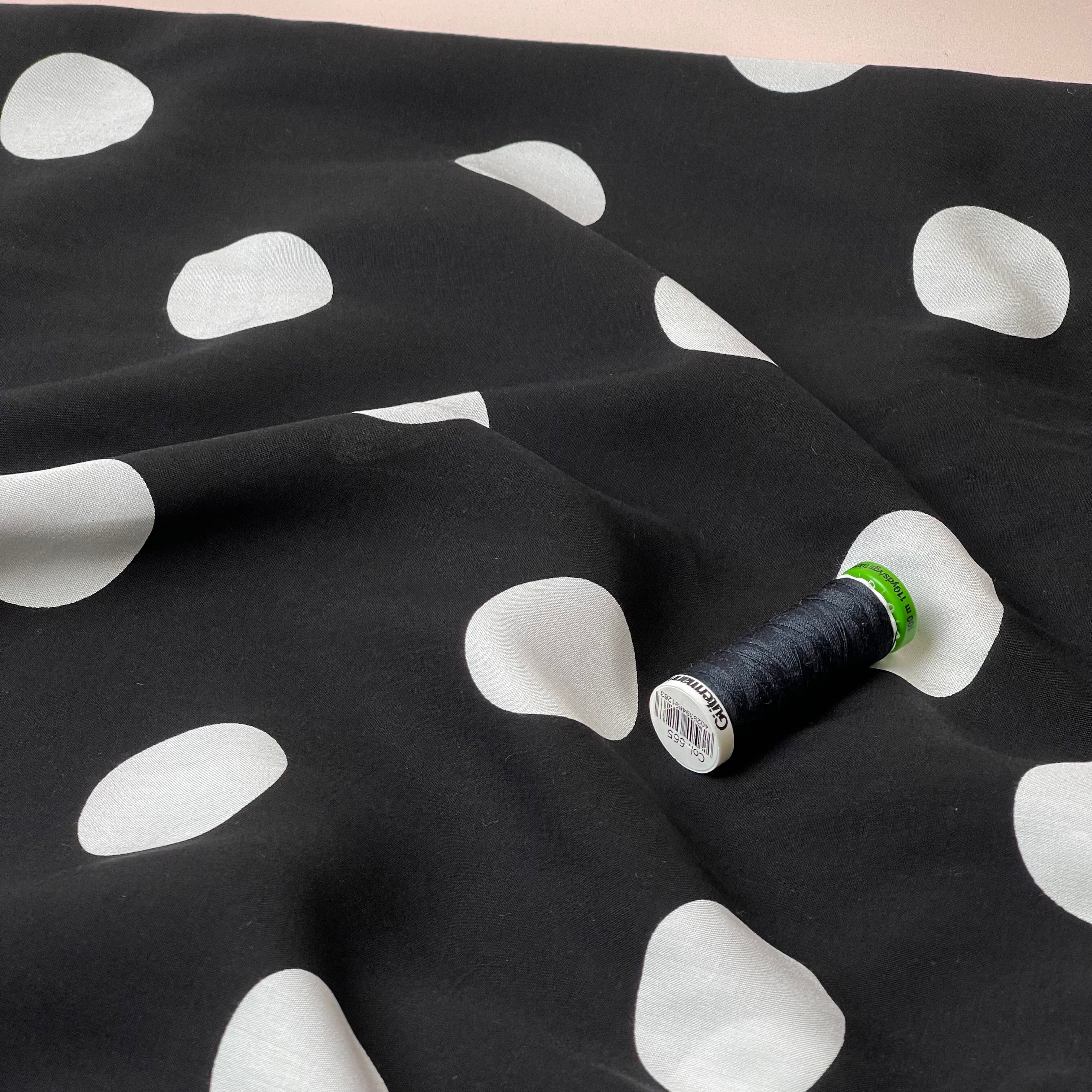 Large Polka Dots on Black Viscose Poplin Fabric