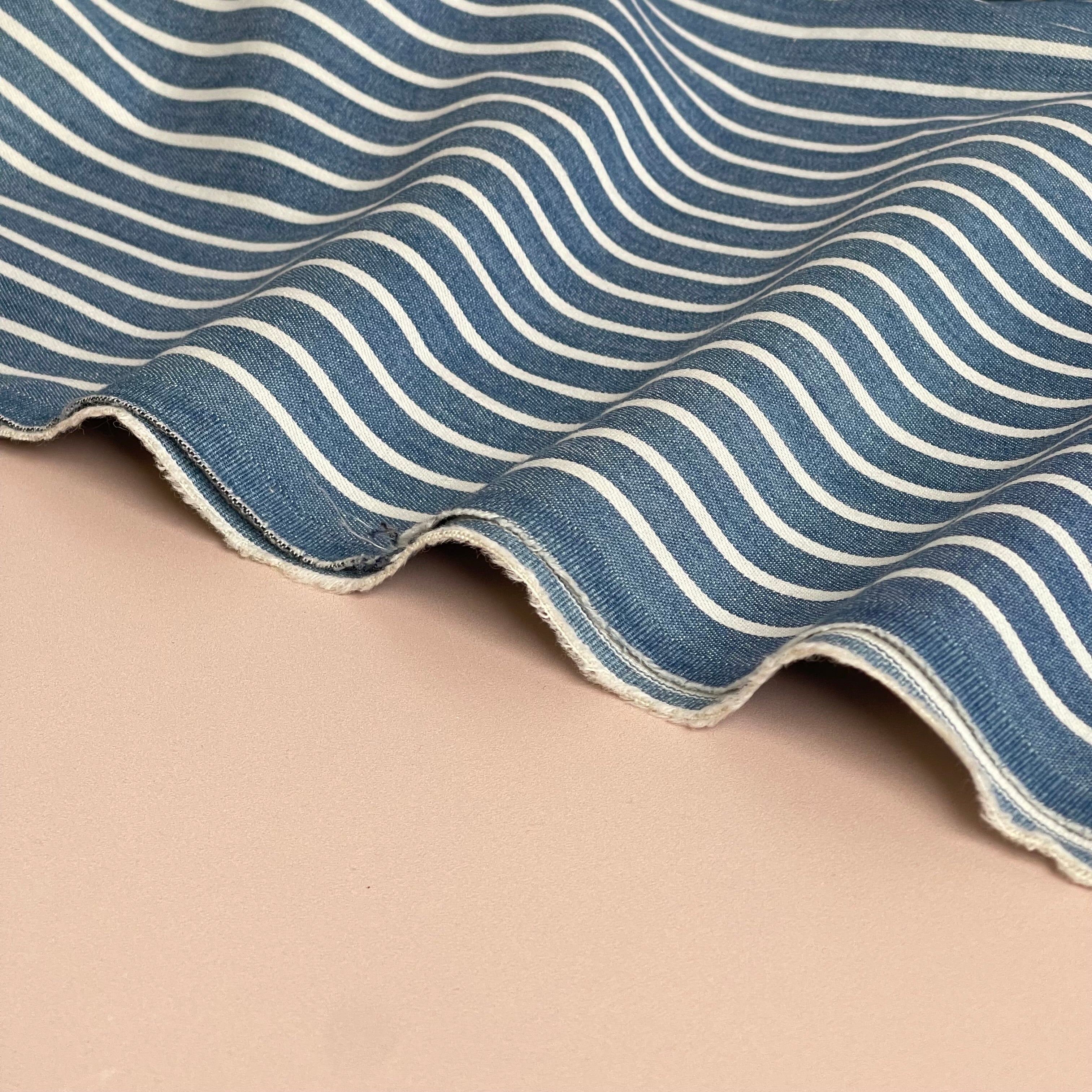 Off-White Stripes on Blue Denim Fabric
