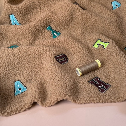 Teddy Boucle with Embroidered Letters Coating Fabric