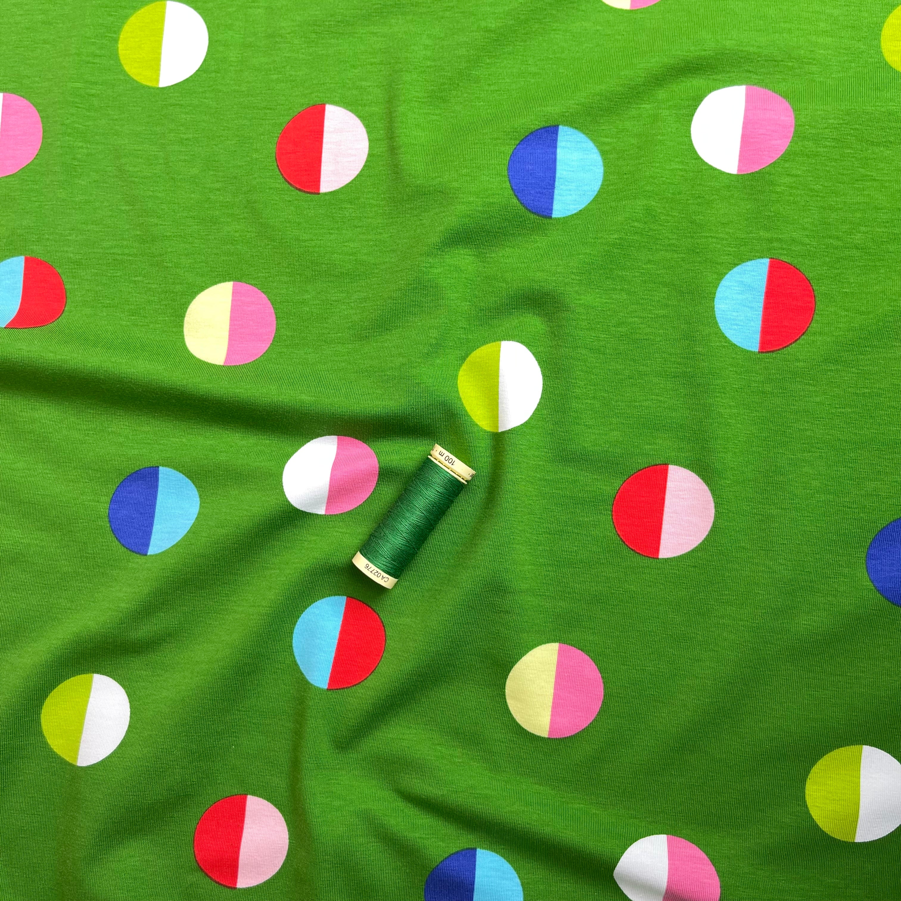 Split Circles on Green Cotton Jersey Fabric