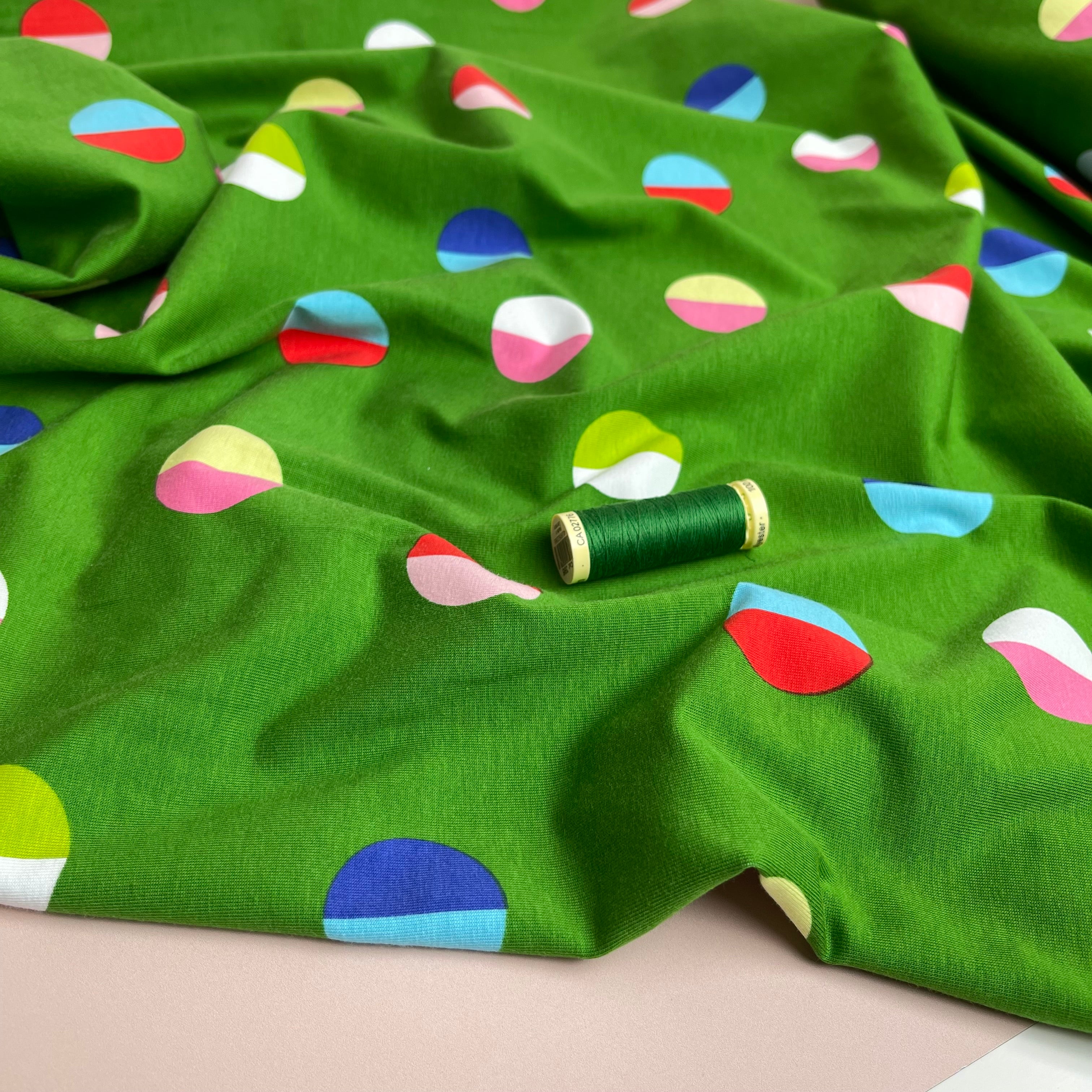 Split Circles on Green Cotton Jersey Fabric