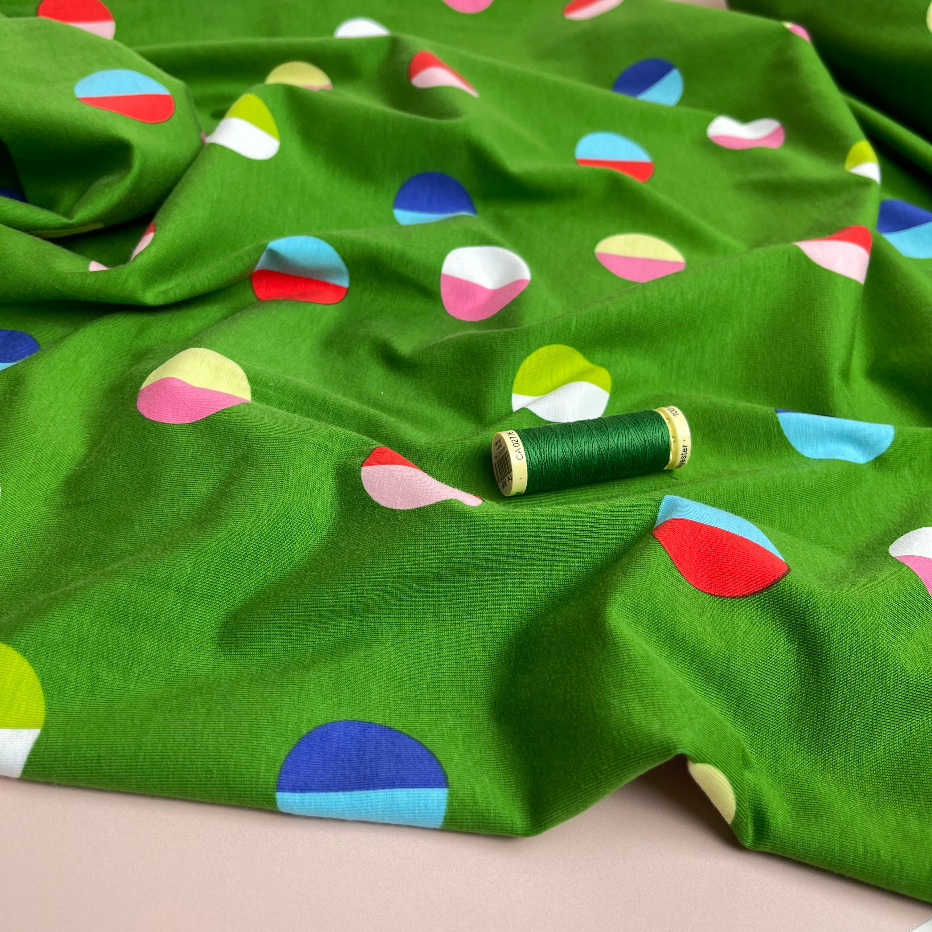 Split Circles on Green Cotton Jersey Fabric