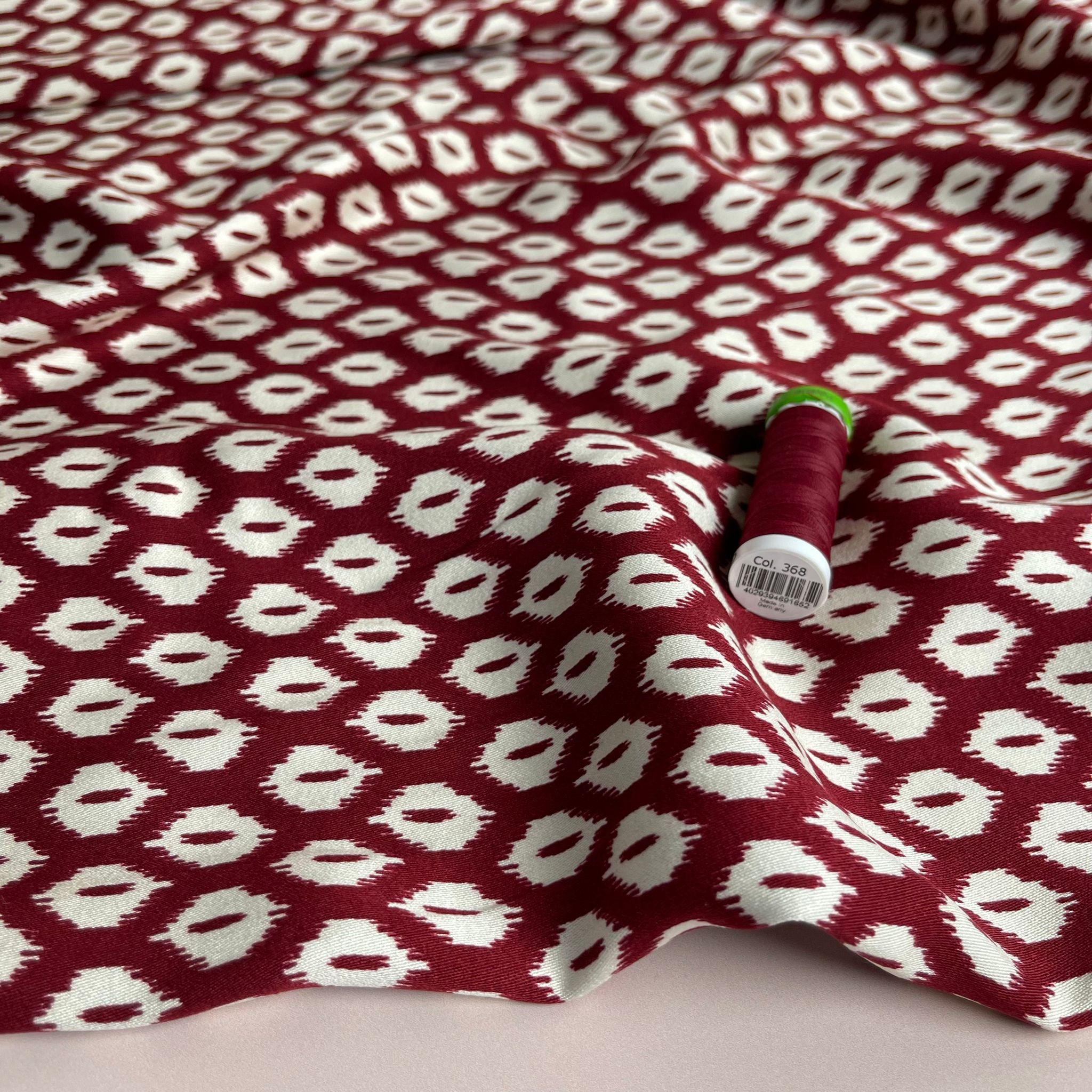 REMNANT 1.79 Metres (plus extra section with slight fading)  - Abstract Rhombus on Burgundy Viscose Twill Sateen Fabric