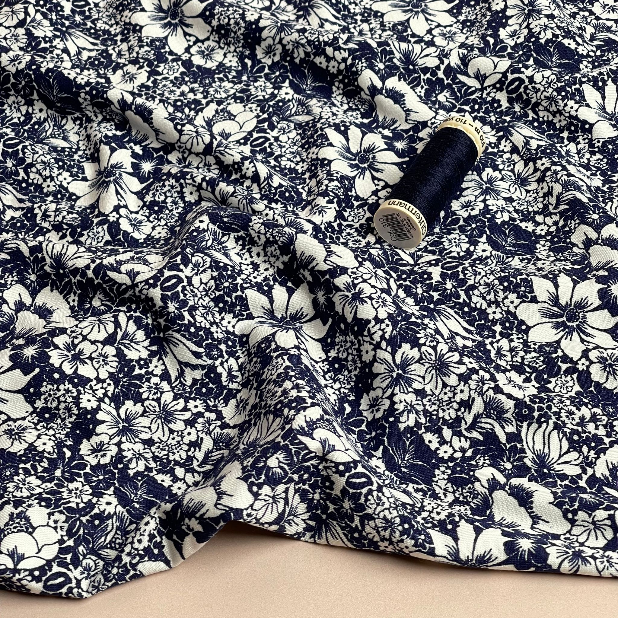 White Flowers on Navy Viscose Jersey Fabric