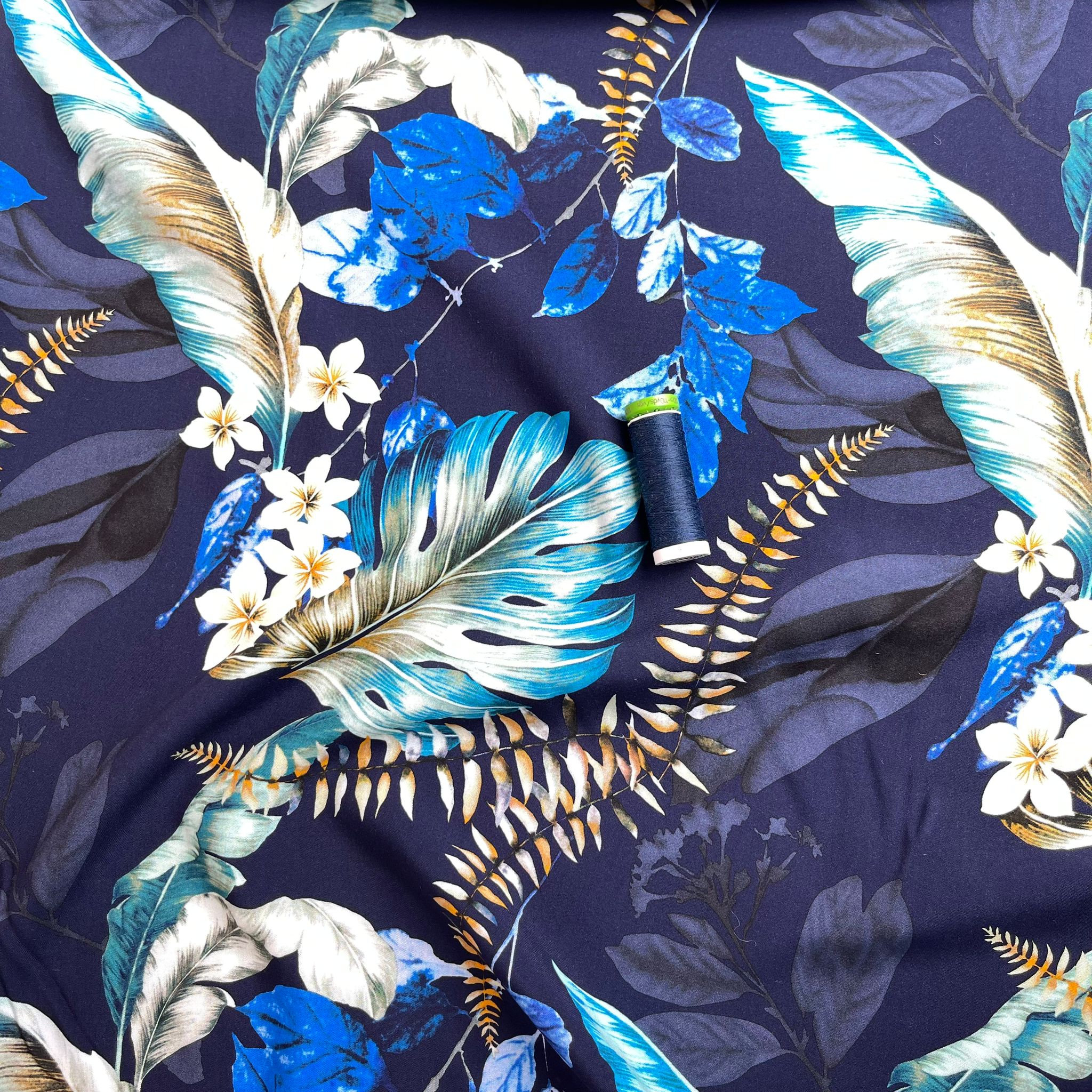 Tropical Turquoise Leaves on Navy Viscose Poplin Fabric
