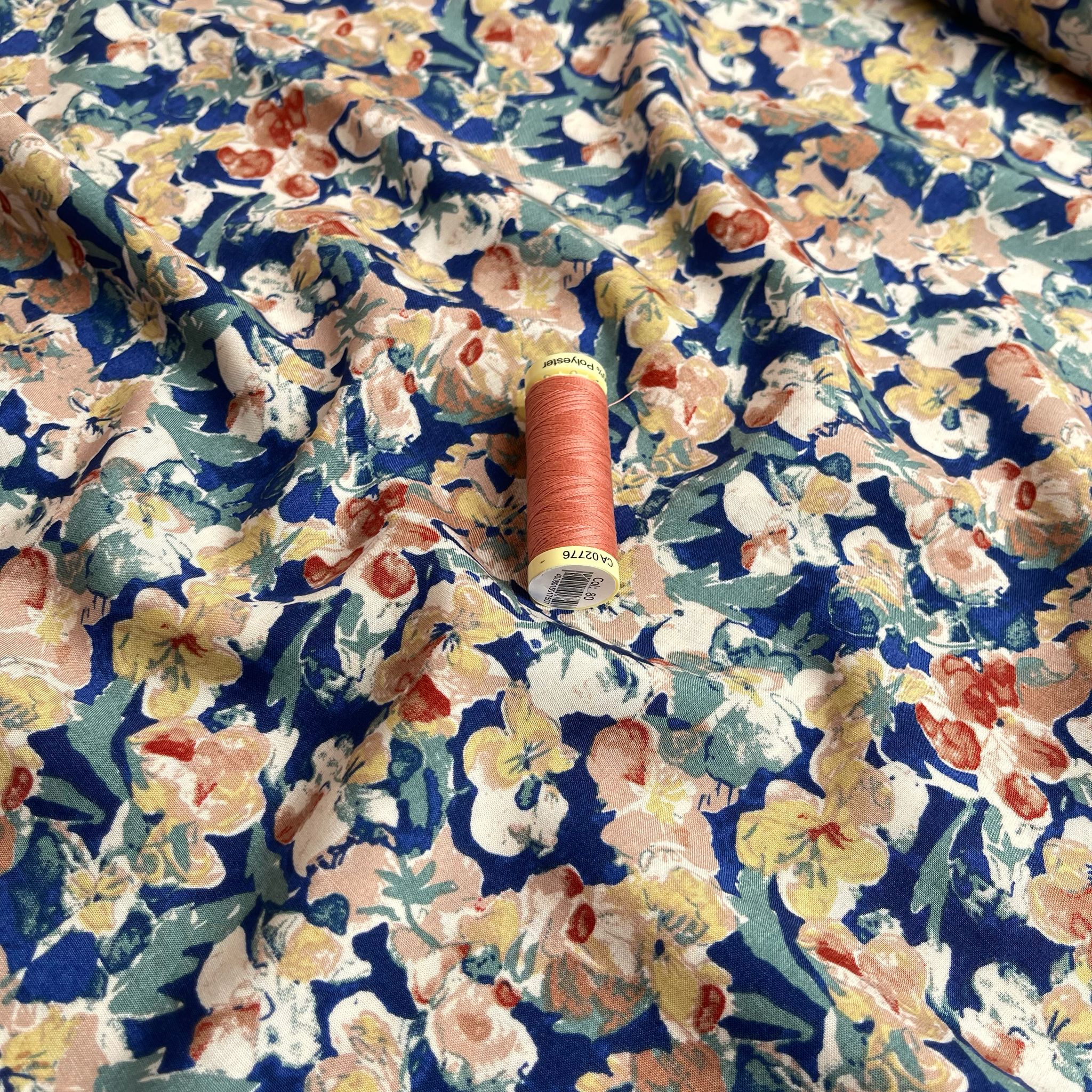 Soft Autumn Blossoms on Blue Viscose Fabric