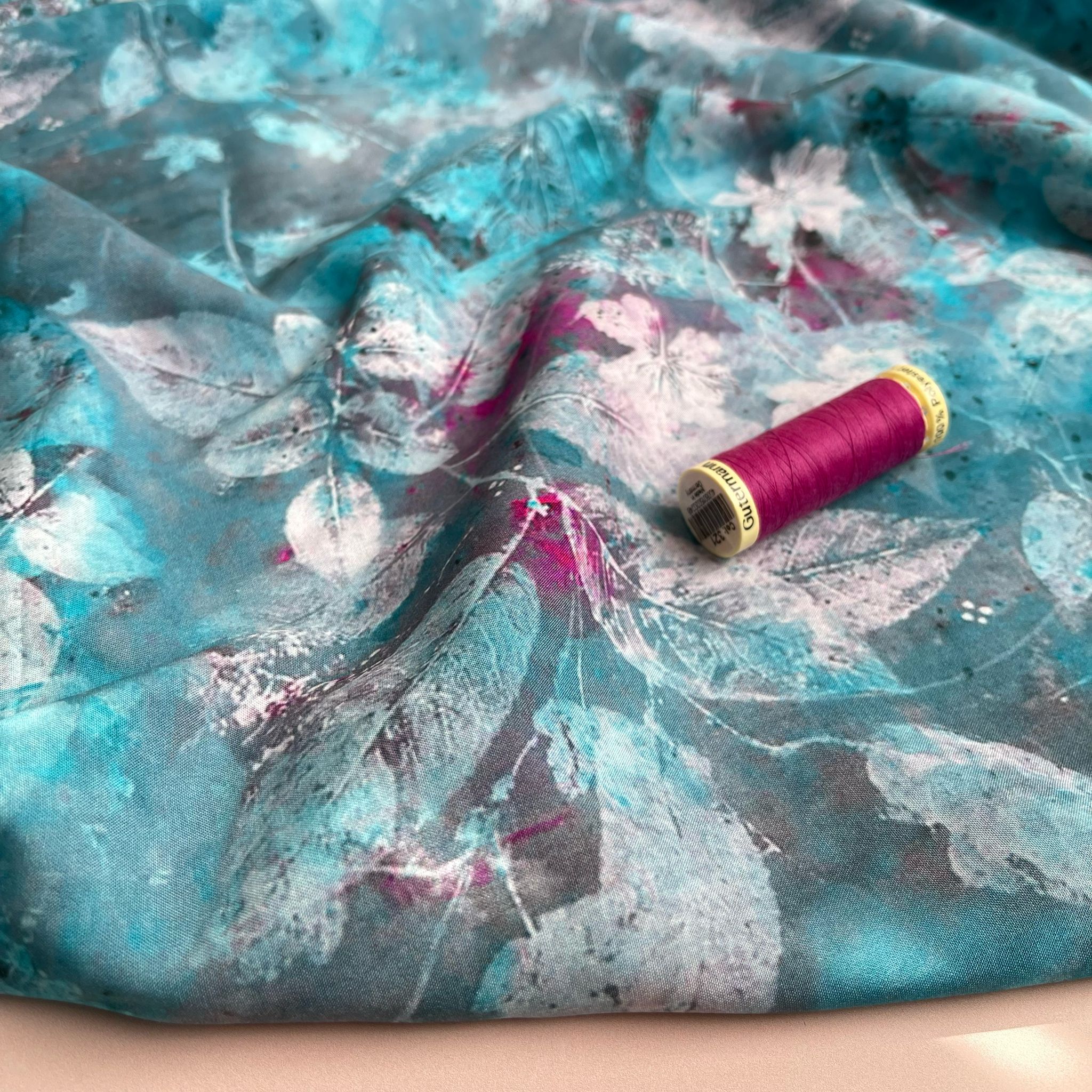 Painted Leaves on Turquoise Viscose Fabric