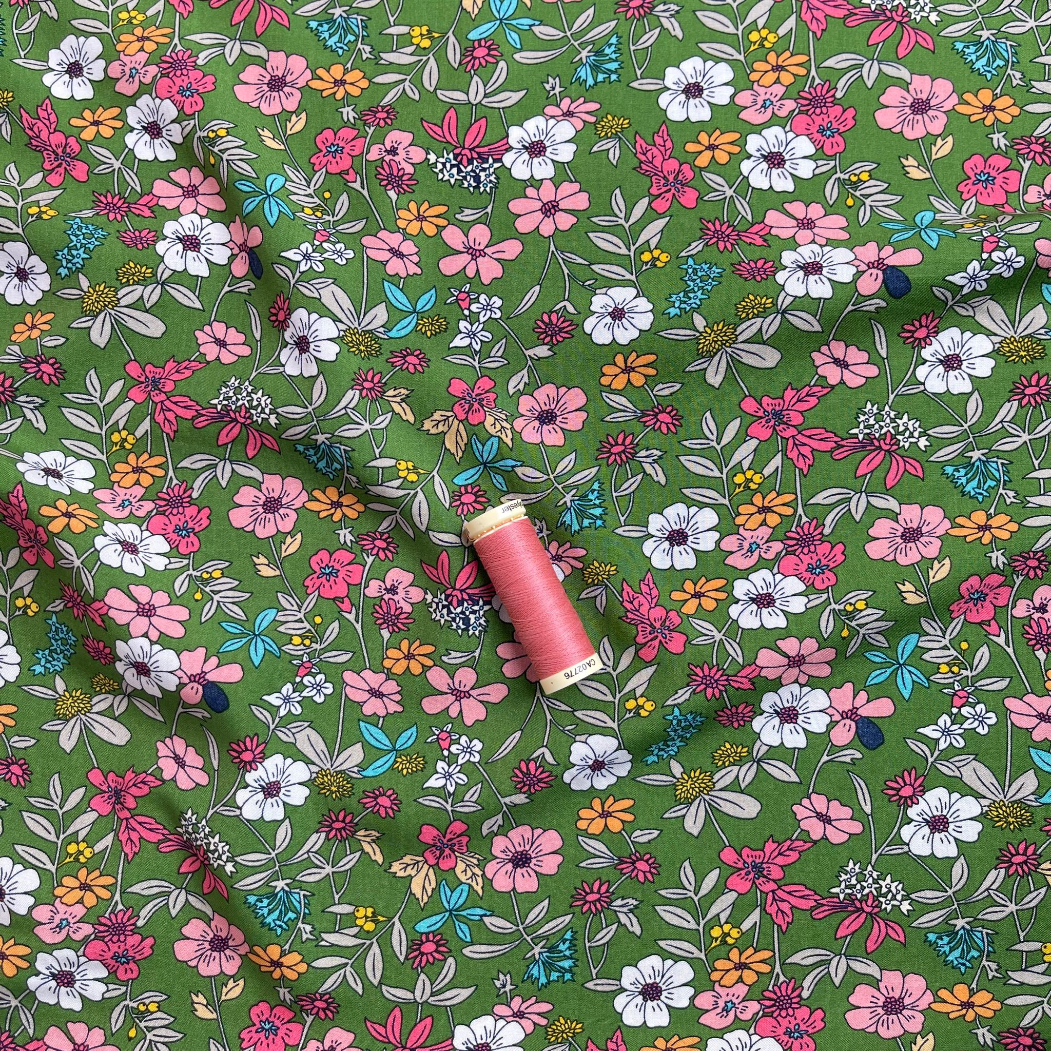 Spring Blossoms on Green Viscose Fabric