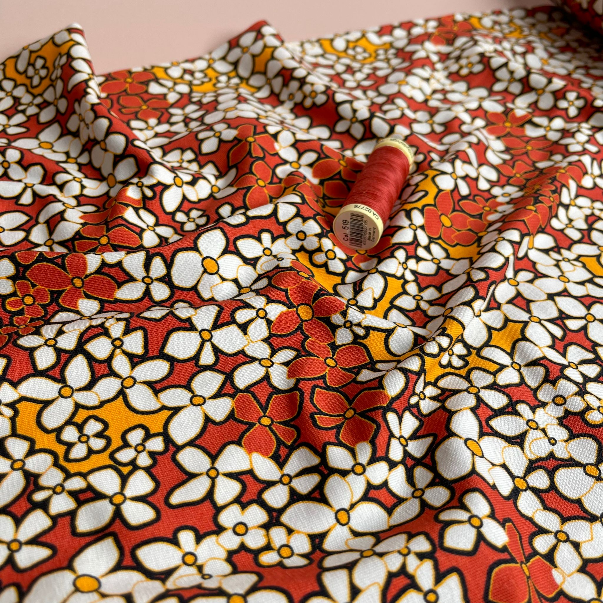 Danish Design - Small Retro Flowers on Burnt Orange Cotton Jersey Fabric