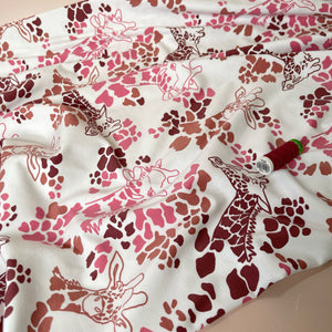 Giraffe's in Red Cotton Jersey Fabric
