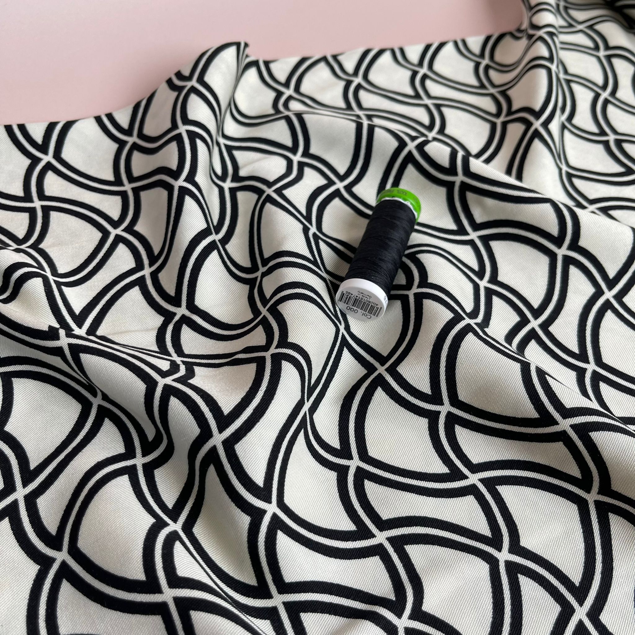 Abstract Waves on Off-White Viscose Twill Fabric