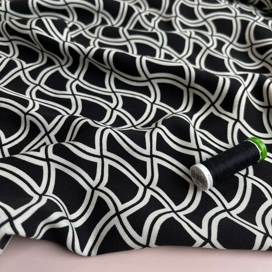 Abstract Waves on Black Viscose Twill Fabric