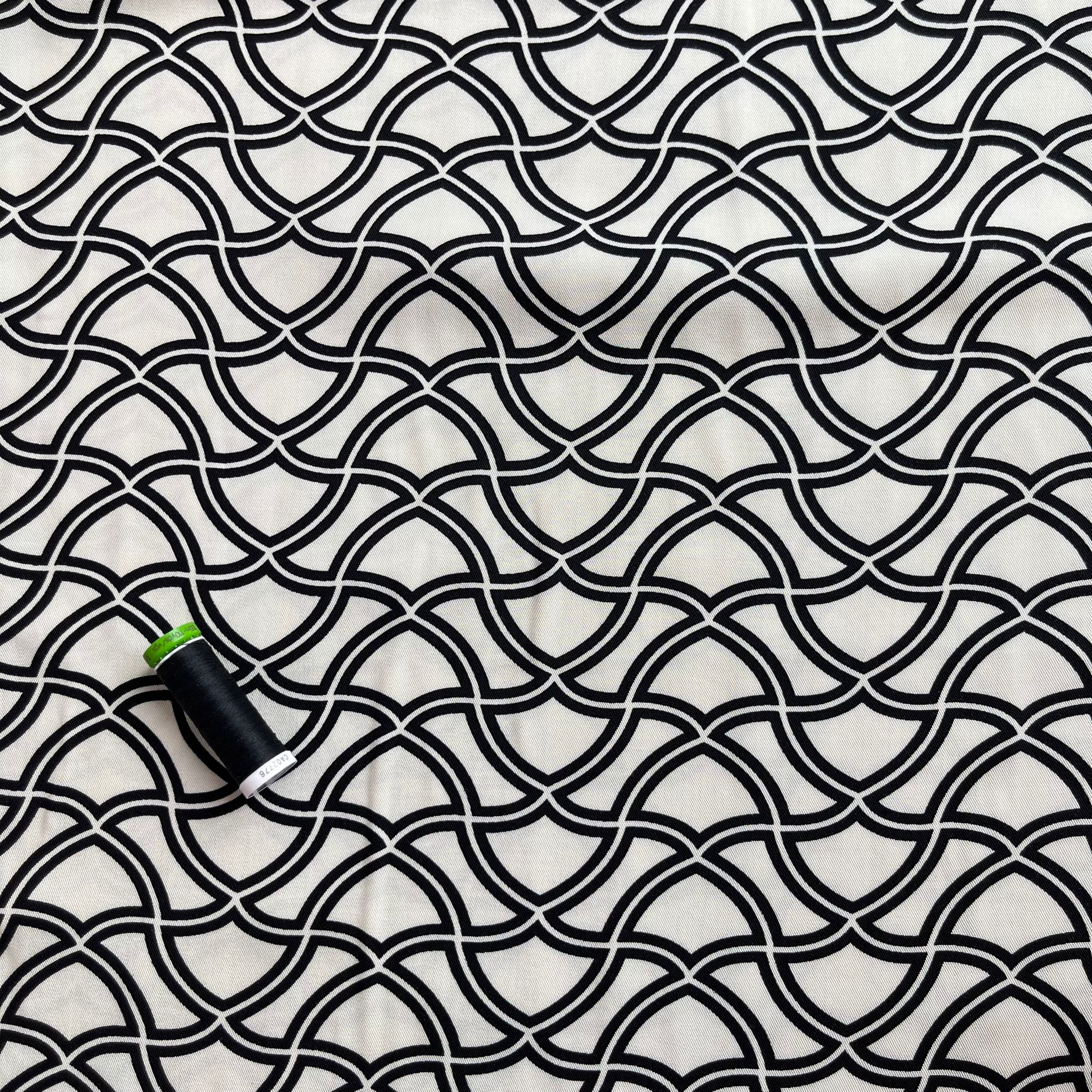 Abstract Waves on Off-White Viscose Twill Fabric