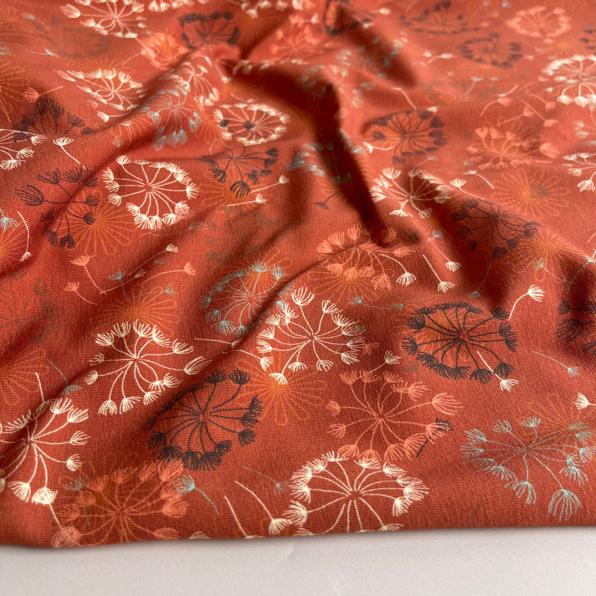 Danish Design - Dandelion on Rust Cotton Jersey Fabric